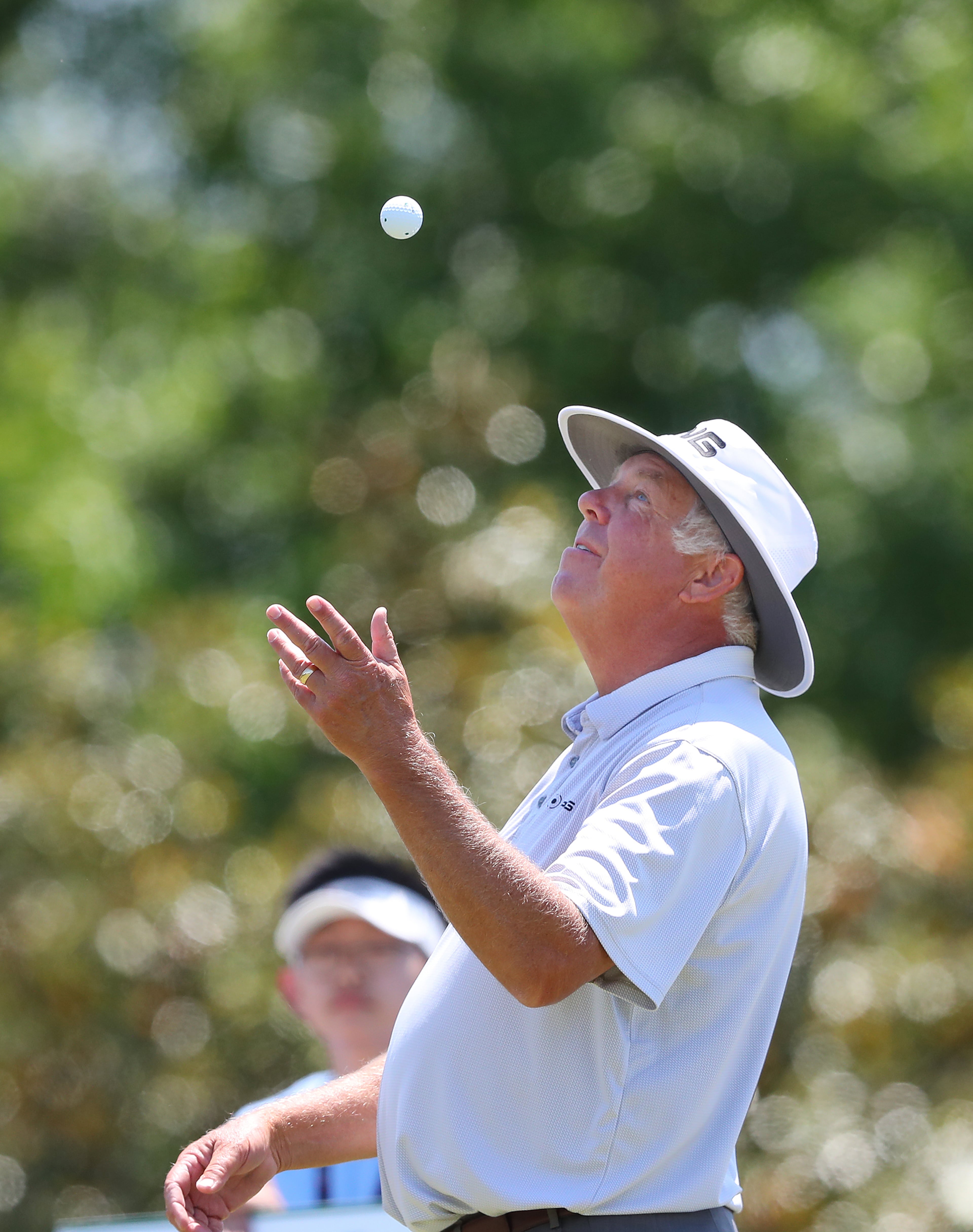 Kirk Triplett tosses his golf ball in the air as he loosens up on the first tee during the final round of the Mitsubishi Electric Classic Sunday, May 16, 2021, at TPC Sugarloaf in Duluth. (Curtis Compton / Curtis.Compton@ajc.com)