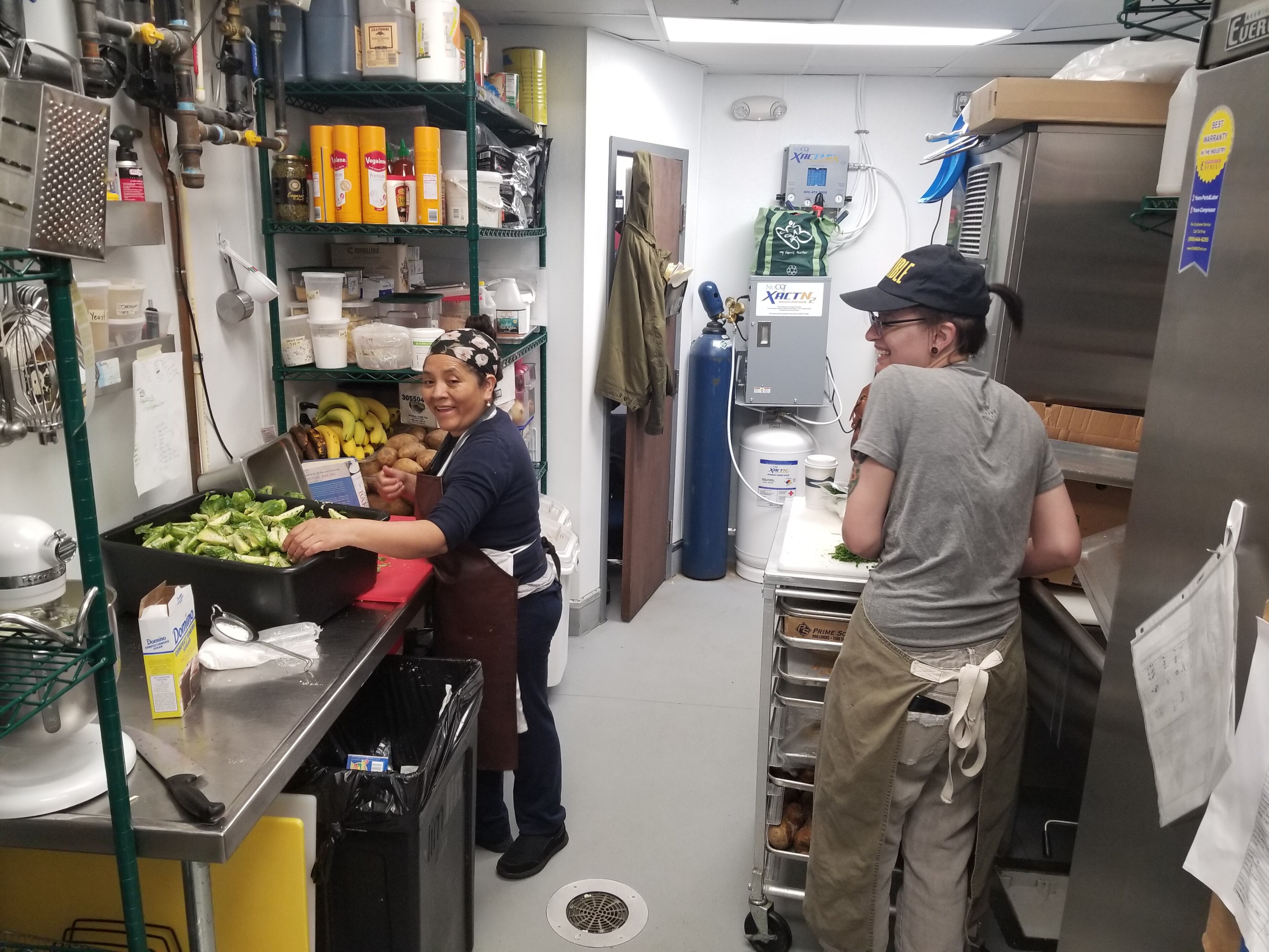 Full Commission executive chef Elodie Westover (right) works with Emiliana Munoz in the small kitchen at the Grant Park restaurant. Westover makes numerous breads in house, including brioche, sourdough, white bread, English muffins and a daily rotation of scones, danishes and gluten-free loaf breads, despite only having one oven. "Any place with that much bread would have two to three ovens," said owner David Traxler. "She has learned how to be a baker in a small kitchen."