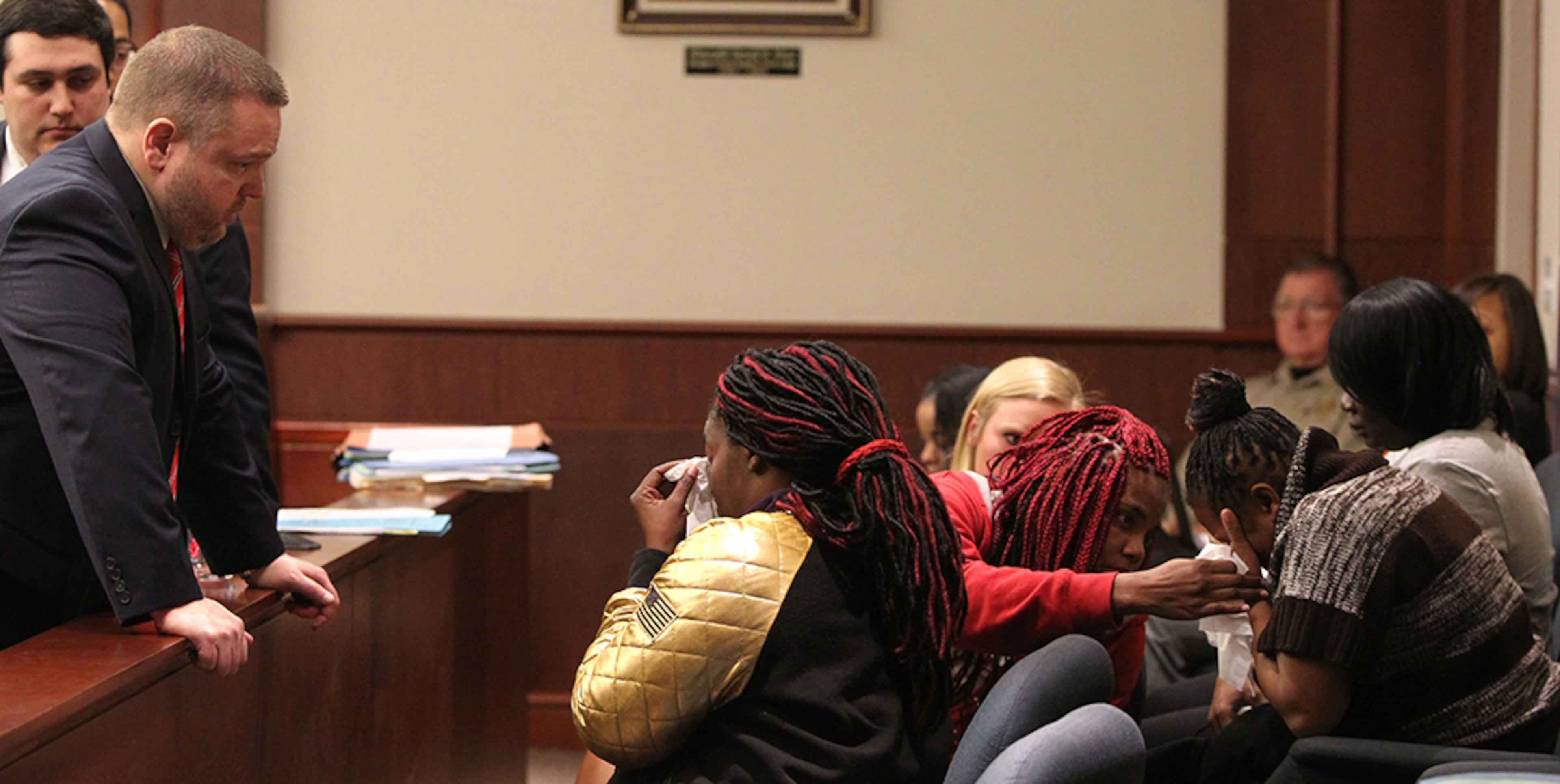 District Attorney Brian Fortner (left) looks over a wall separating the jury crowd from the rest of the court to ask Hyesha Bryant (center) if the group needs anything while Melissa Alfred (right, striped sweater) weeps at the Douglas County Courthouse in Douglasville, Georgia, on Monday, February 27, 2017. It was after Kayla Norton spoke on behalf of herself and pleaded for mercy that Bryant decided to step up and respond to Norton, during which she said she forgave her. (HENRY TAYLOR / HENRY.TAYLOR@AJC.COM)
