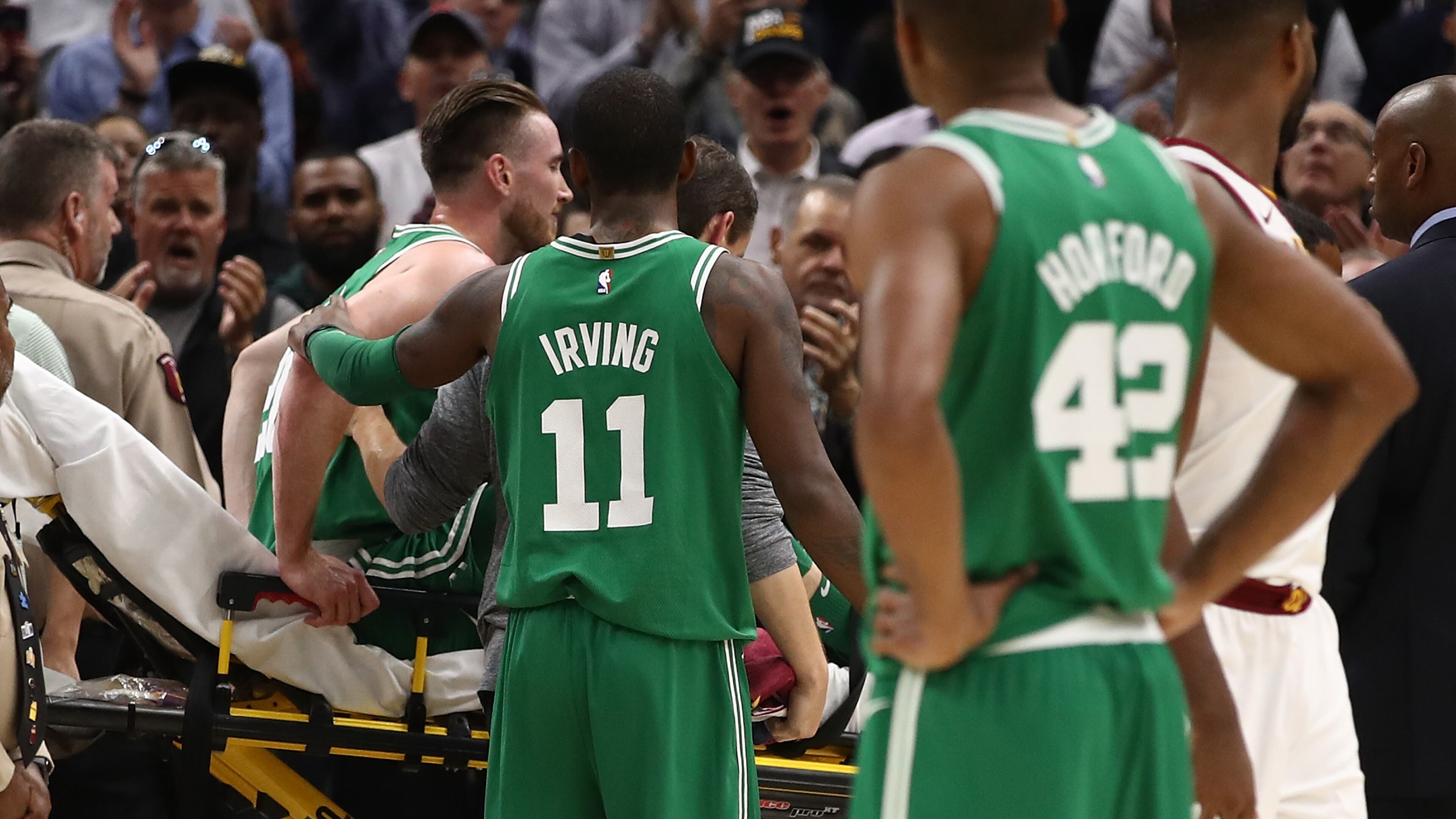 CLEVELAND, OH - OCTOBER 17: Kyrie Irving #11 of the Boston Celtics consoles Gordon Hayward #20 after Hayward was injured while playing the Cleveland Cavaliers at Quicken Loans Arena on October 17, 2017 in Cleveland, Ohio. NOTE TO USER: User expressly acknowledges and agrees that, by downloading and or using this photograph, User is consenting to the terms and conditions of the Getty Images License Agreement. (Photo by Gregory Shamus/Getty Images)