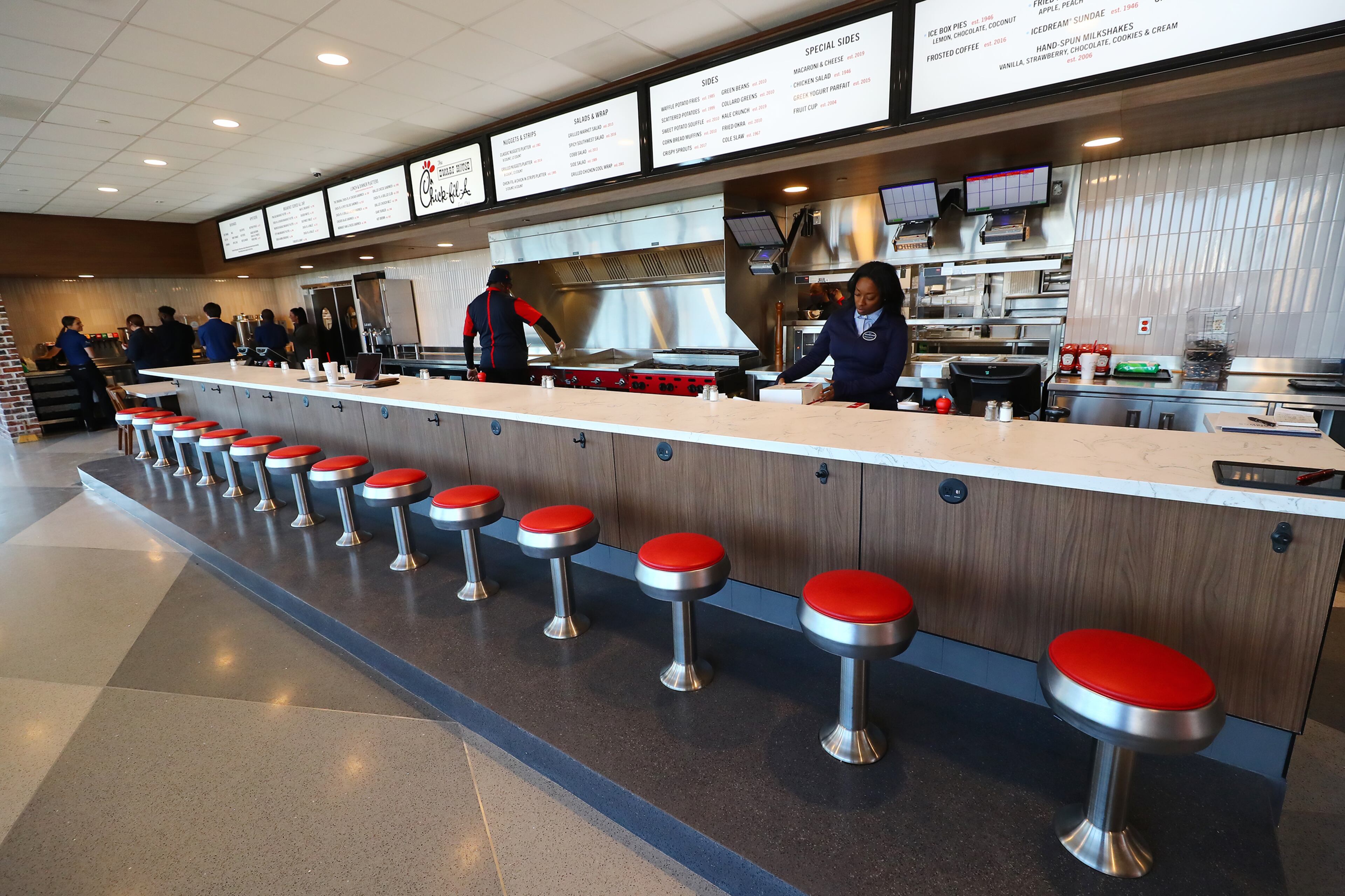 021422 Hapeville: Fourteen original stools from the 1967 building line the restaurant counter inside the newly renovated Dwarf House, the first of Truett Cathey’s restaurants, on Monday, Feb. 14, 2022, in Hapeville. “Curtis Compton / Curtis.Compton@ajc.com”`