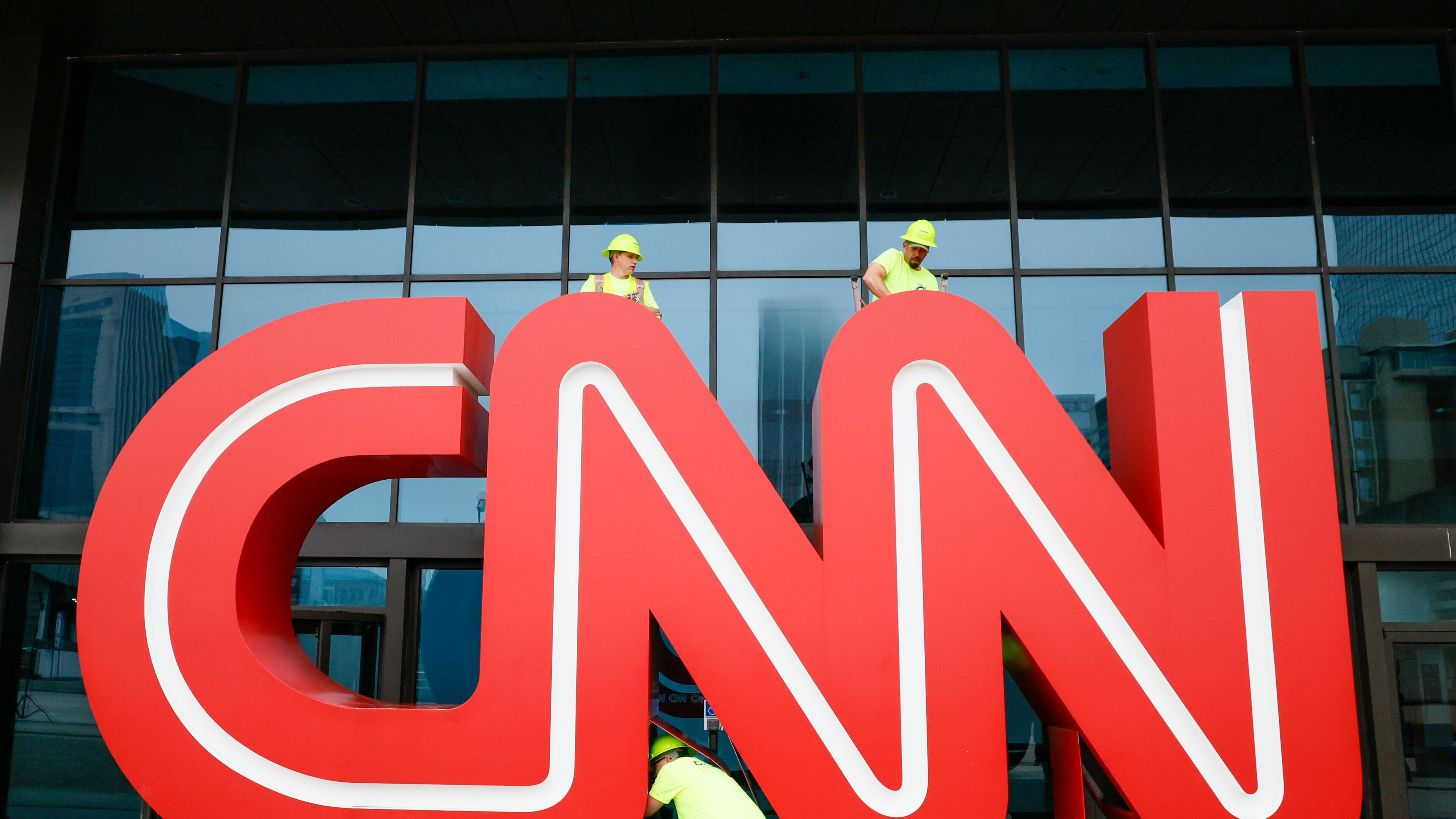 Workers remove the bolts on the 12-foot, red-and-white iconic CNN sign outside of what was once CNN Center, 2024. The news organization has since relocated its Atlanta operations to Techwood Drive.
(Miguel Martinez/AJC)