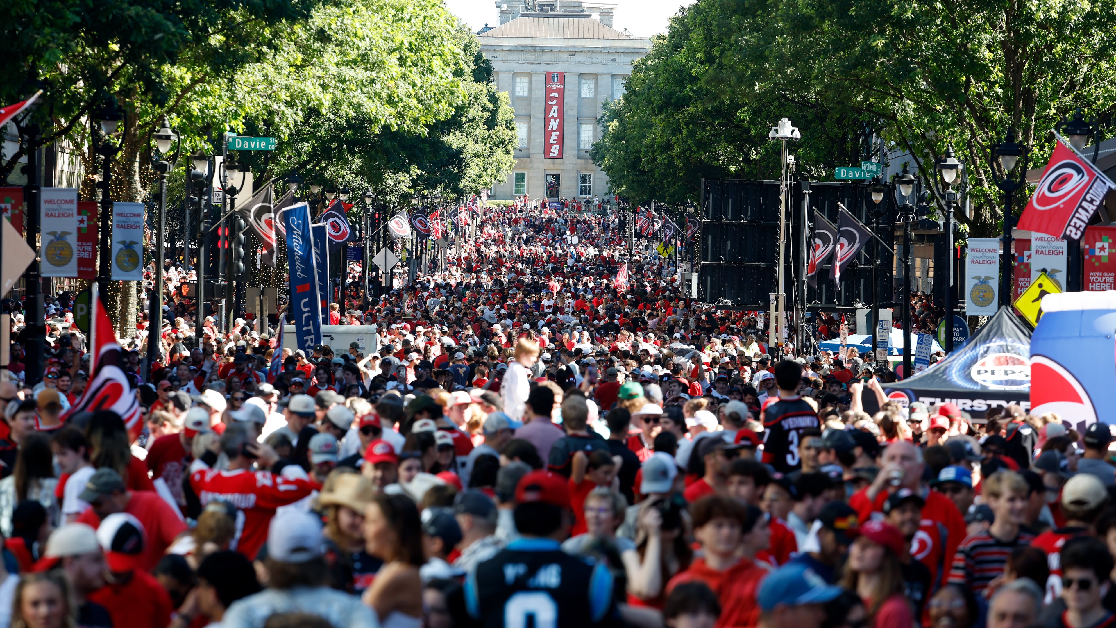 Carolina Hurricanes fans crowd onto Fayetteville Street prior to the start of the Stanley Cup Championship celebration in Raleigh, N.C., Saturday, June 20, 2026. (AP Photo/Karl DeBlaker)
