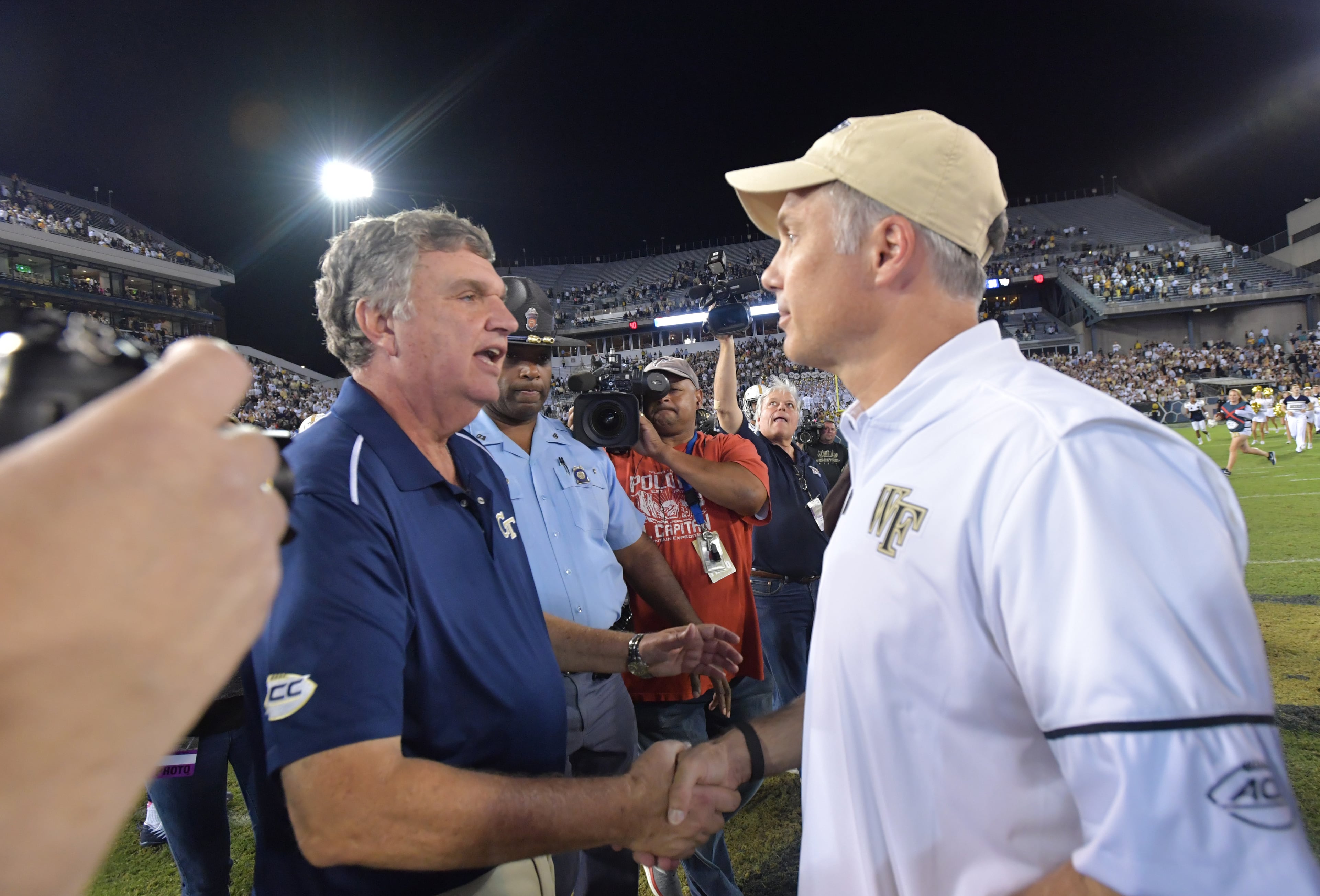 October 21, 2017 Atlanta - Georgia Tech head coach Paul Johnson and Wake Forest head coach Dave Clawson shake hands after Georgia Tech beats Wake Forest 38-24 in an NCAA college football game at Bobby Dodd Stadium on Saturday, October 21, 2017. HYOSUB SHIN / HSHIN@AJC.COM