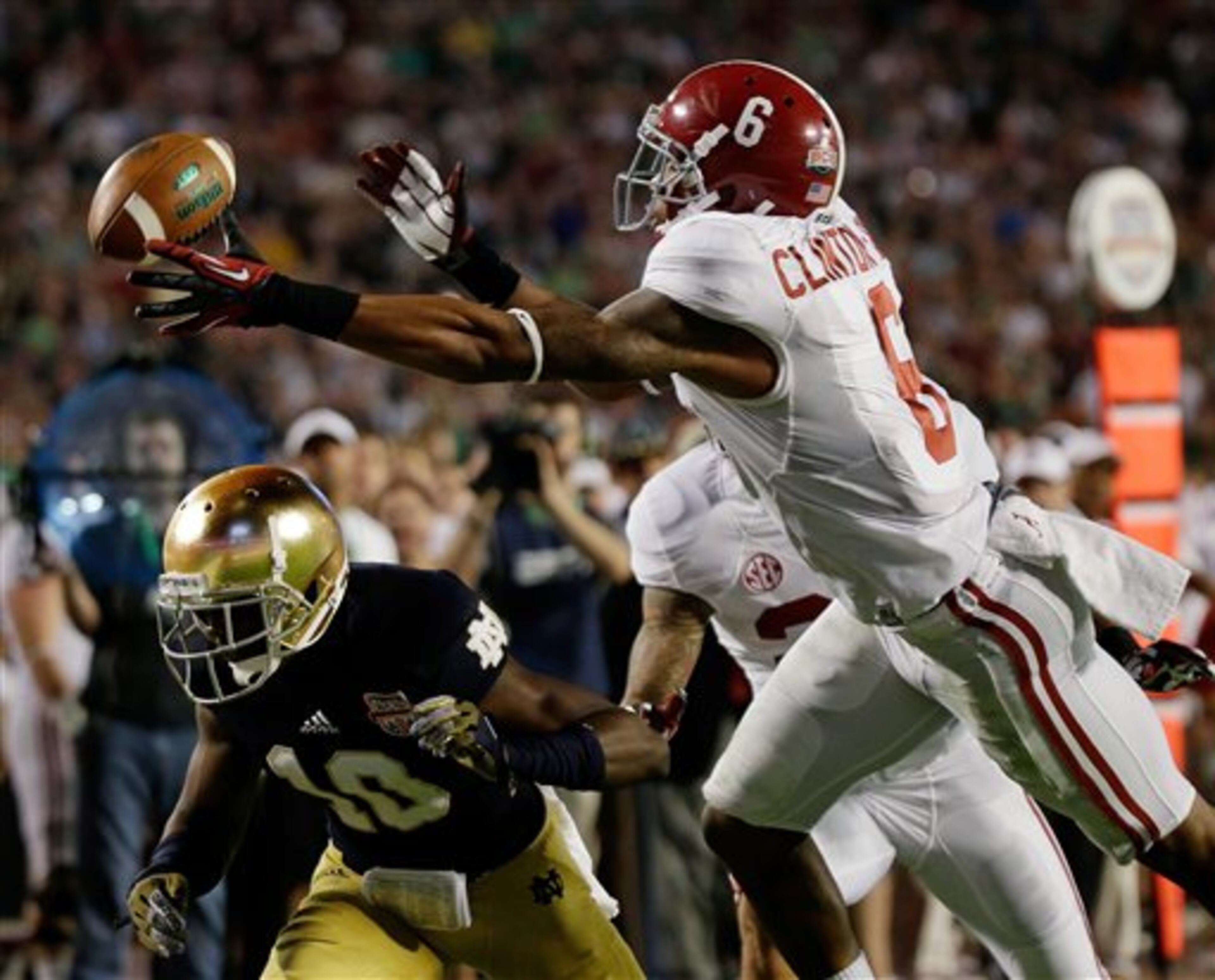 Alabama's Ha'Sean Clinton-Dix (6) intercepts a pass over Notre Dame's DaVaris Daniels (10) during the second half of the BCS National Championship college football game Monday, Jan. 7, 2013, in Miami. (AP Photo/David J. Phillip)