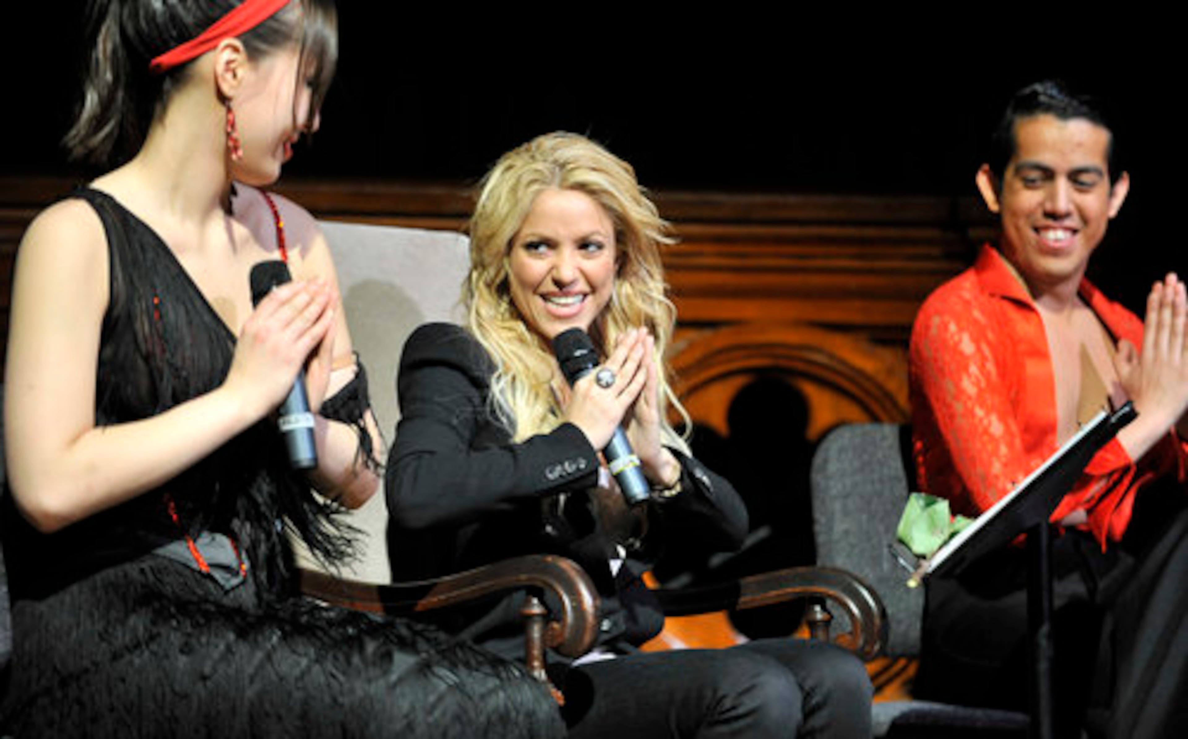 Shakira sings one of her songs with members of the Harvard Ballroom Dance Team after the team's performance at Harvard on Feb. 26, 2011, where Shakira was named the Harvard Foundation Artist of the Year.