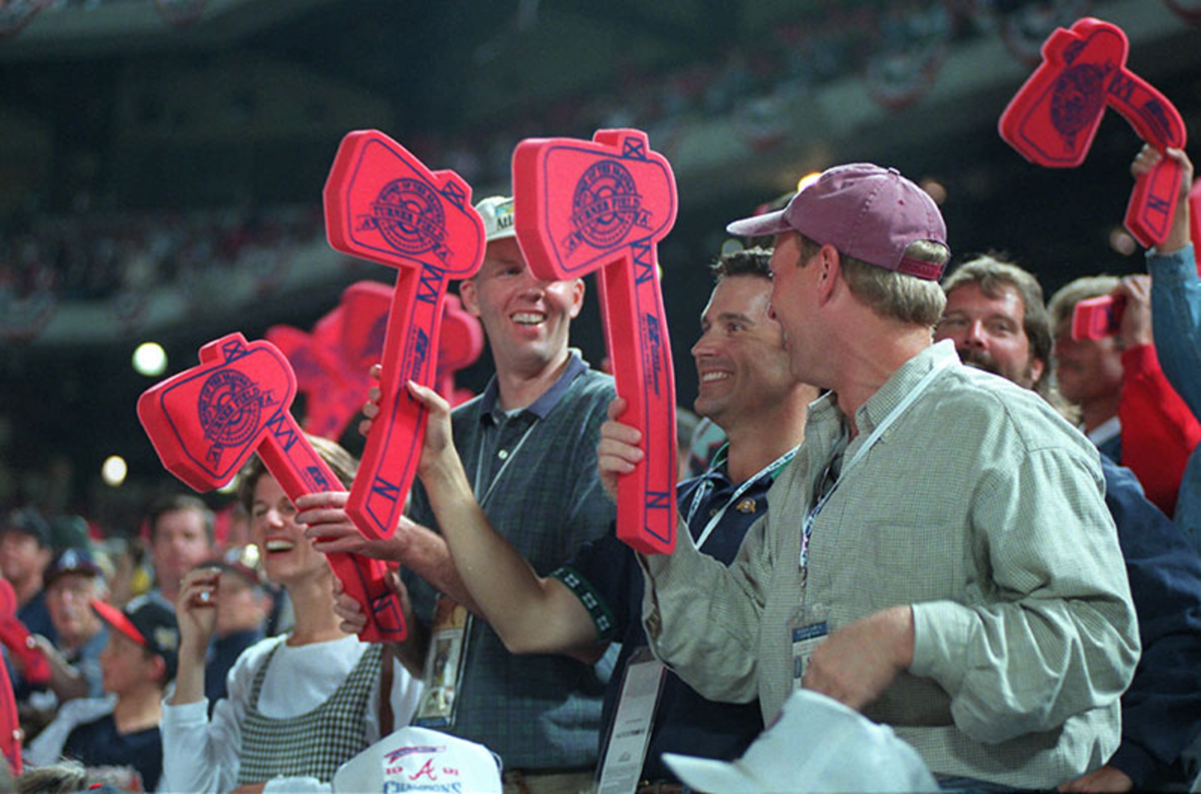 Fans cheer on the first regular season game at Turner Field on Friday, April 4, 1997.