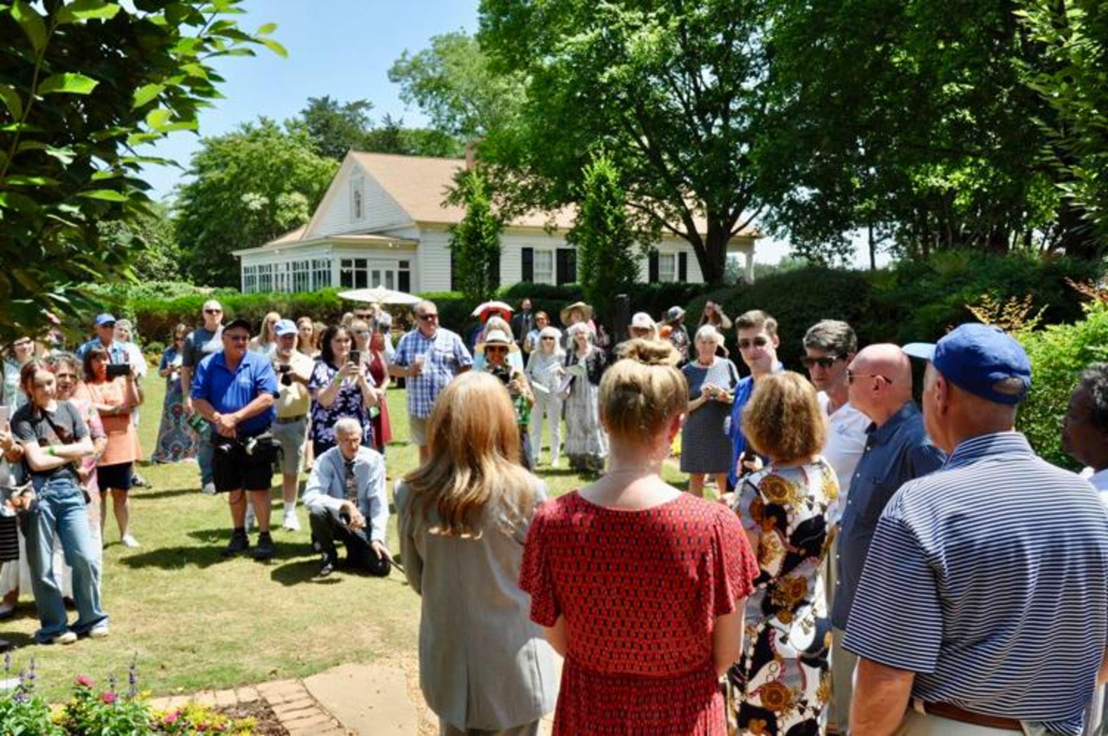 A crowd gathers for the tree dedication for Mickey Kuhn and Patrick Curtis Saturday at Brumby Hall. (Photo Courtesy of Stuart Hendrick)