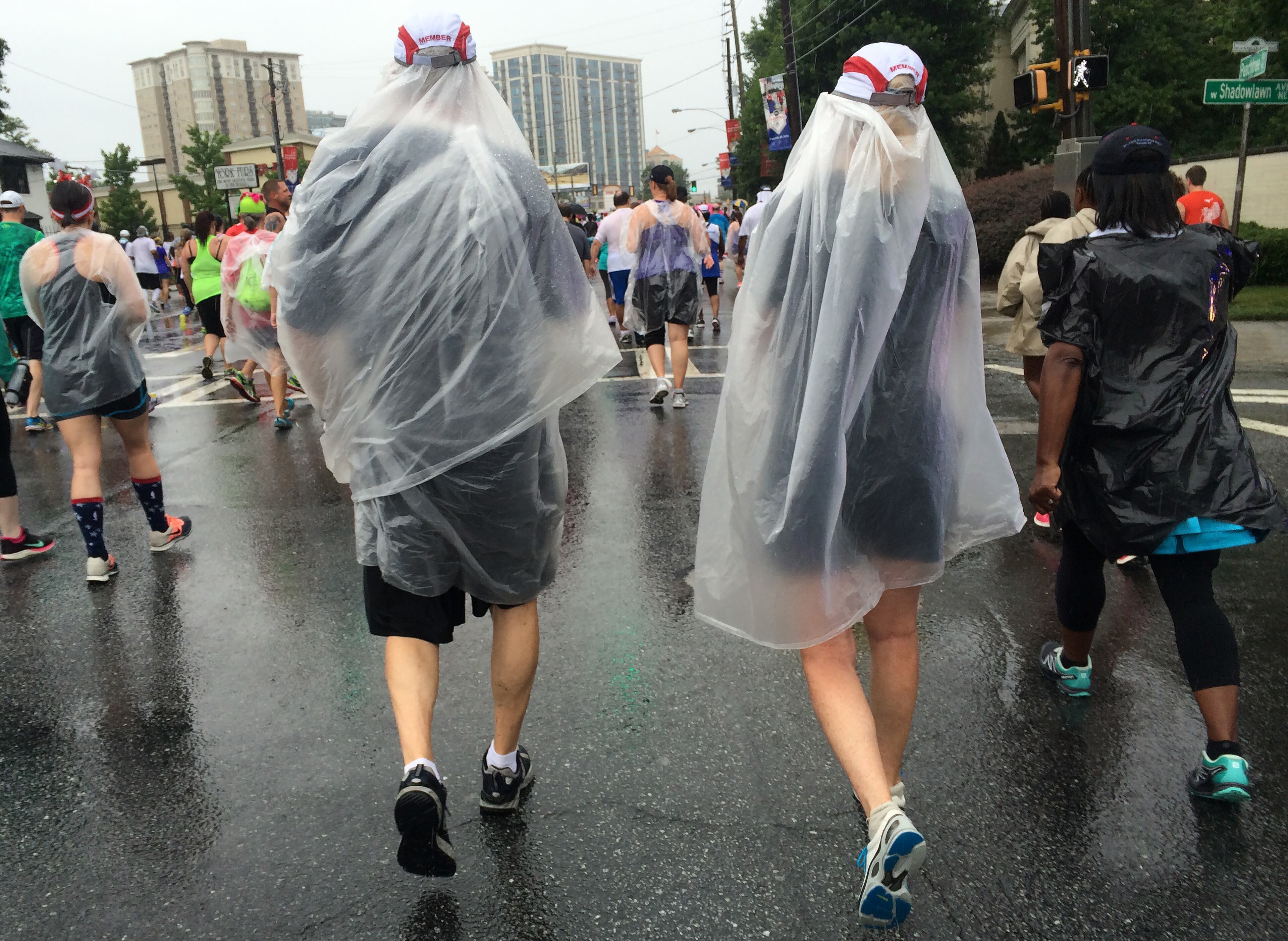 Garbage bags were high fashion during a wet and soggy AJC Peachtree Road Race on Saturday July 4, 2015.