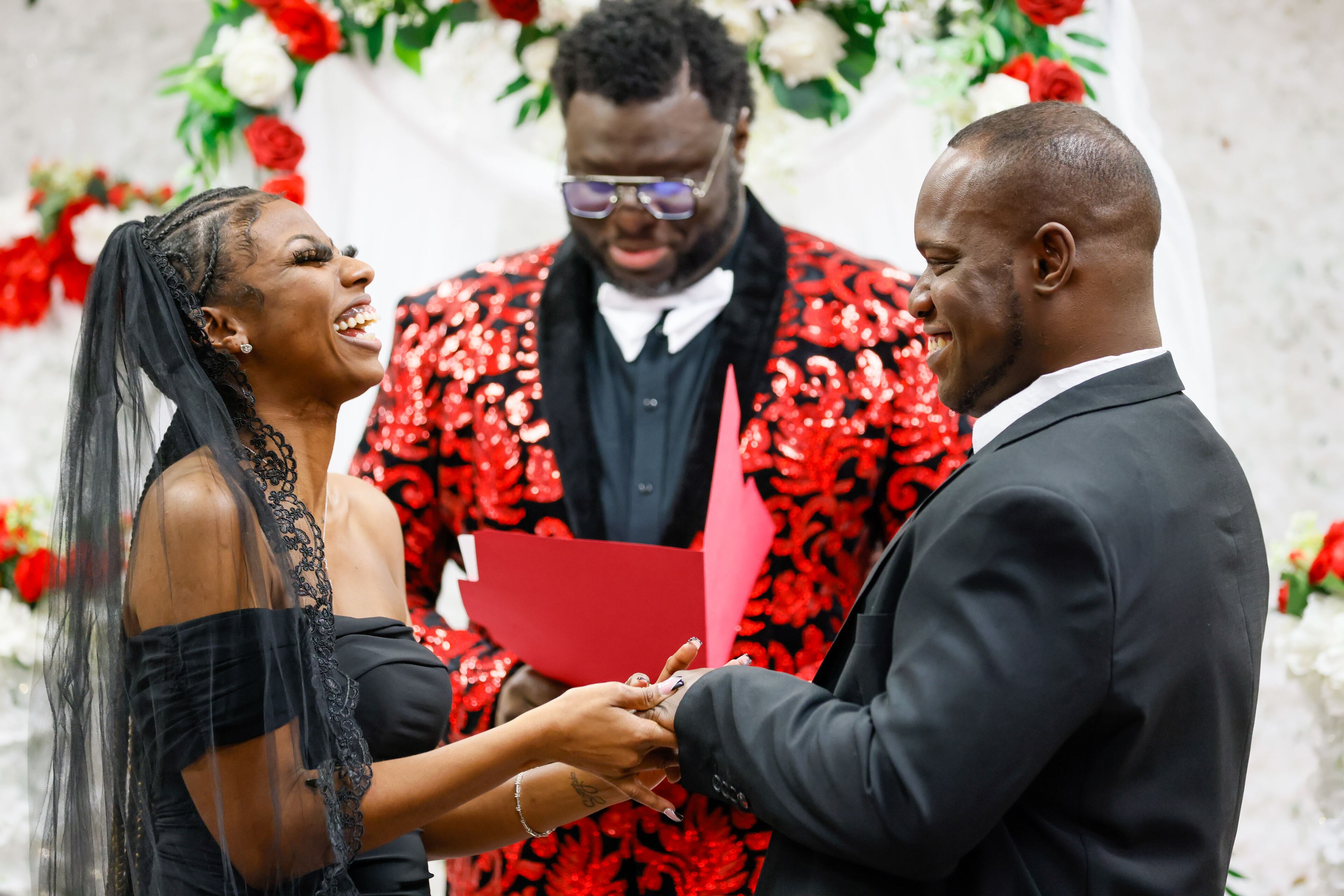 Mark Owens and his wife, Elexus Owens, react as he puts the ring on her during Valentine’s Day Free Weddings at the Fulton County Probate Court on Wednesday, Feb. 14, 2024, in Atlanta.
Miguel Martinez /miguel.martinezjimenez@ajc.com
