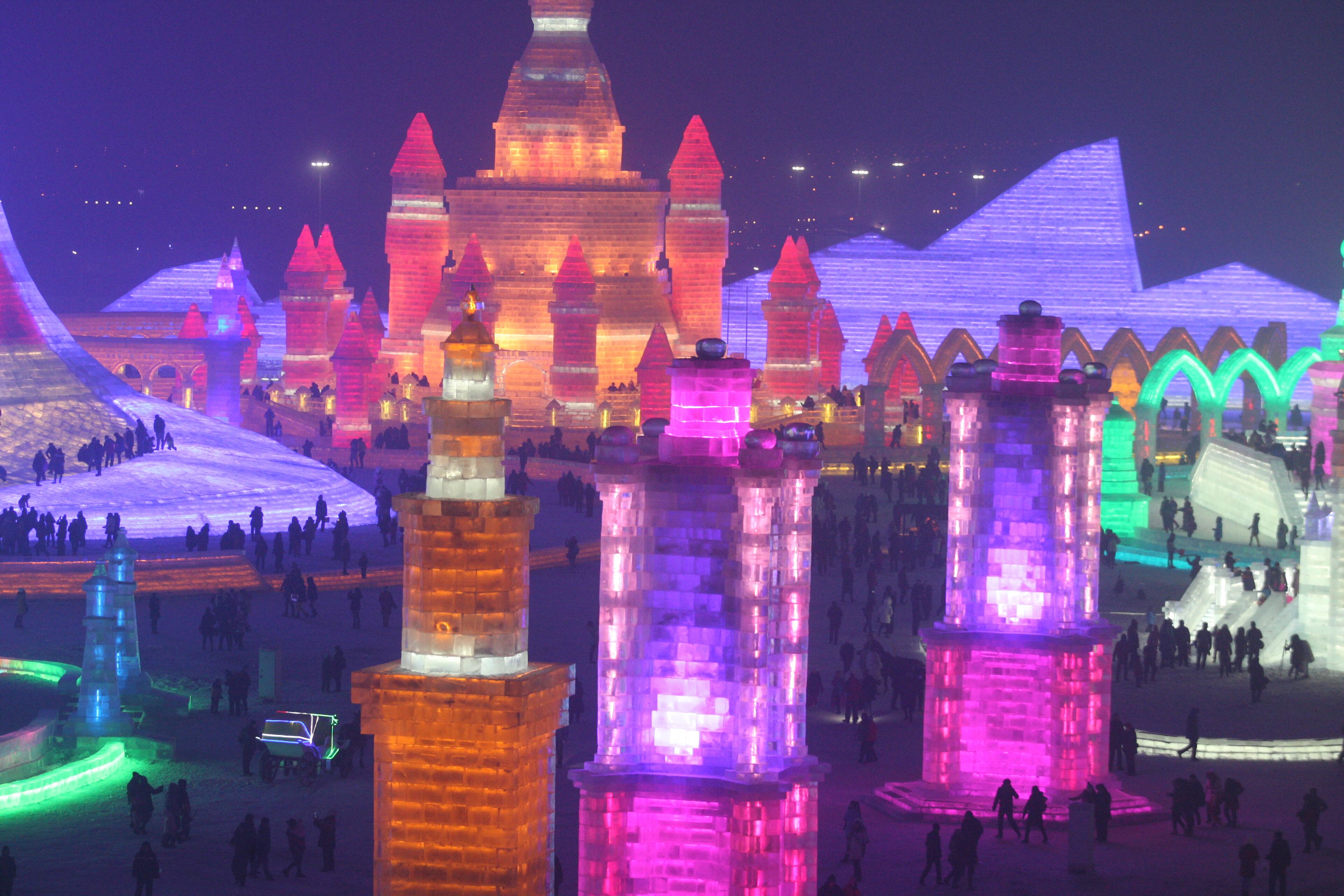HARBIN, CHINA - DECEMBER 22: (CHINA OUT) Tourists visit the 17th Harbin Ice And Snow World during its test run on December 22, 2015 in Harbin, China. The event will run from December 25, 2015 to February 25, 2016. (Photo by ChinaFotoPress/ChinaFotoPress via Getty Images)