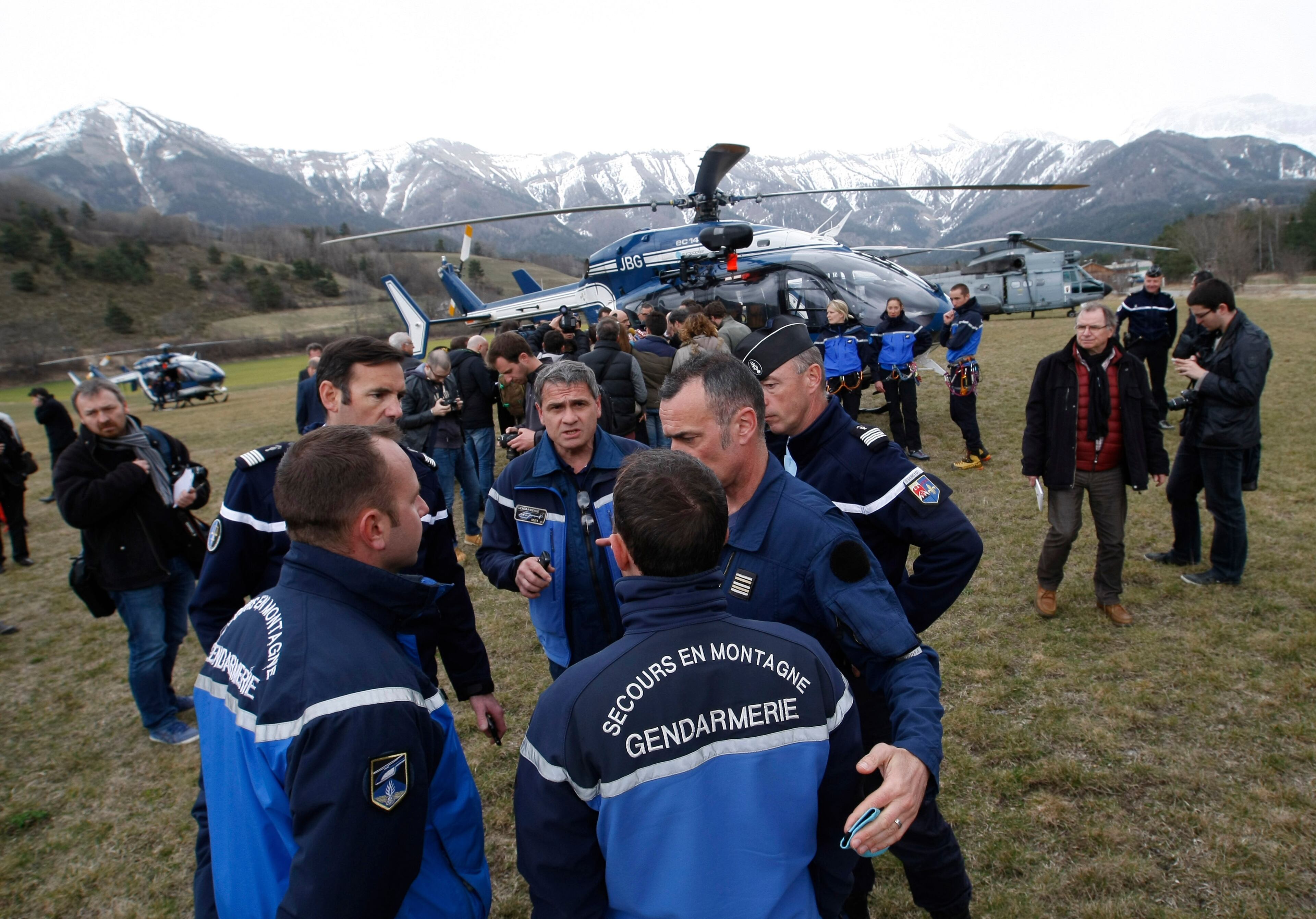 Rescue workers and gendarme gather in Seyne-les-Alpes, French Alps, Tuesday, March 24, 2015, as search-and-rescue teams struggle to reach the remote crash site of Germanwings passenger plane. A Germanwings passenger jet carrying 150 people crashed Tuesday in the French Alps as it flew from Spain's Barcelona airport to Duesseldorf in Germany, authorities said.(AP Photo/Claude Paris)