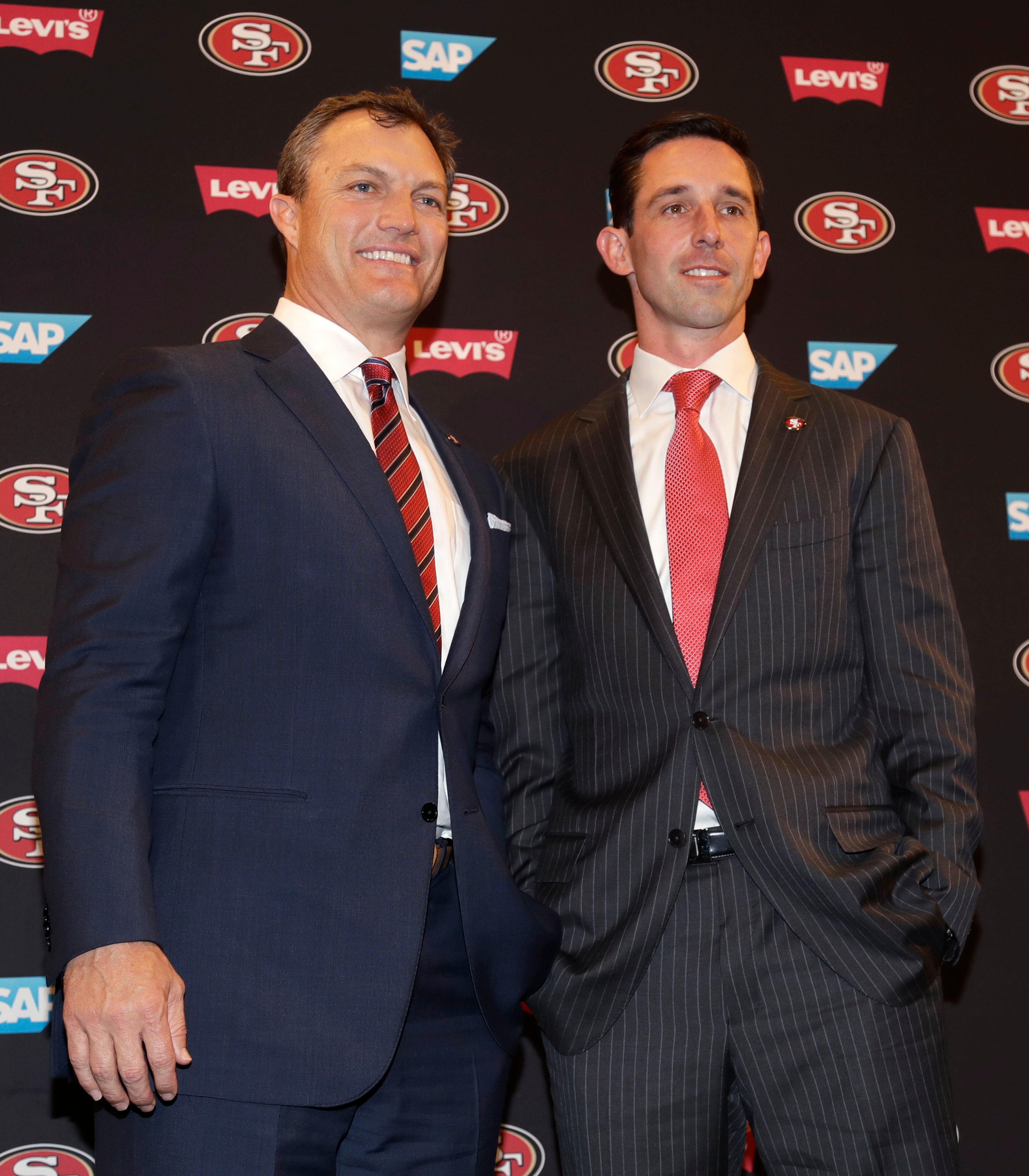 San Francisco 49ers head coach Kyle Shanahan, right, and general manager John Lynch pose for photos during an NFL football press conference Thursday, Feb. 9, 2017, in Santa Clara, Calif. (AP Photo/Marcio Jose Sanchez)