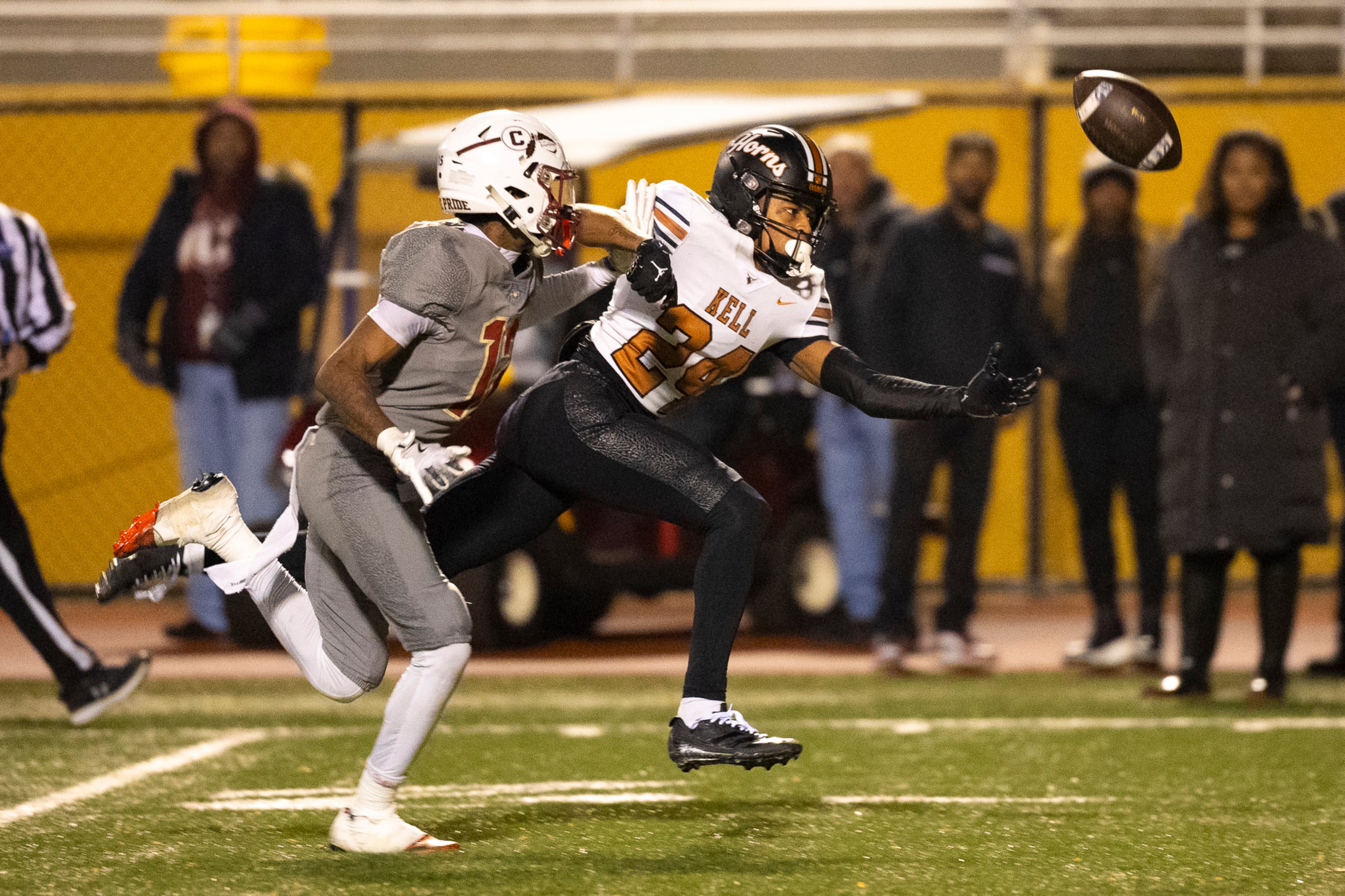 Kell defensive back Kamoni Adams (right) goes for the catch and misses during the Class 4A semifinal against Creekside on Friday, Dec. 5, 2025, at Creekside High School in Fairburn. (Oscar Guevara Saenz for the AJC)