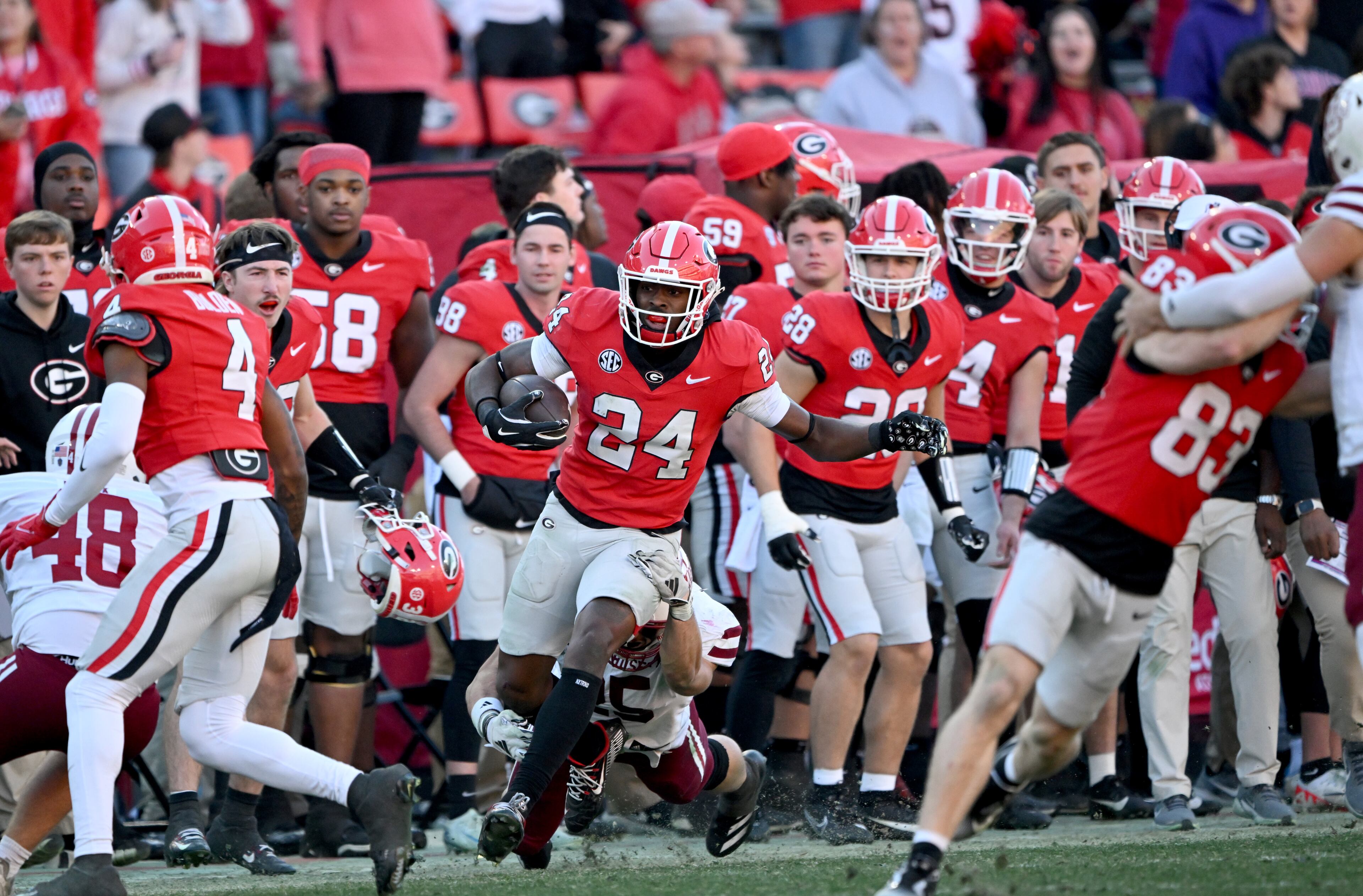 Georgia defensive back Malaki Starks (24) returns a punt during the second half in an NCAA football game at Sanford Stadium, Saturday, November 23, 2024, in Athens. Georgia won 59-21 over UMass. (Hyosub Shin / AJC)