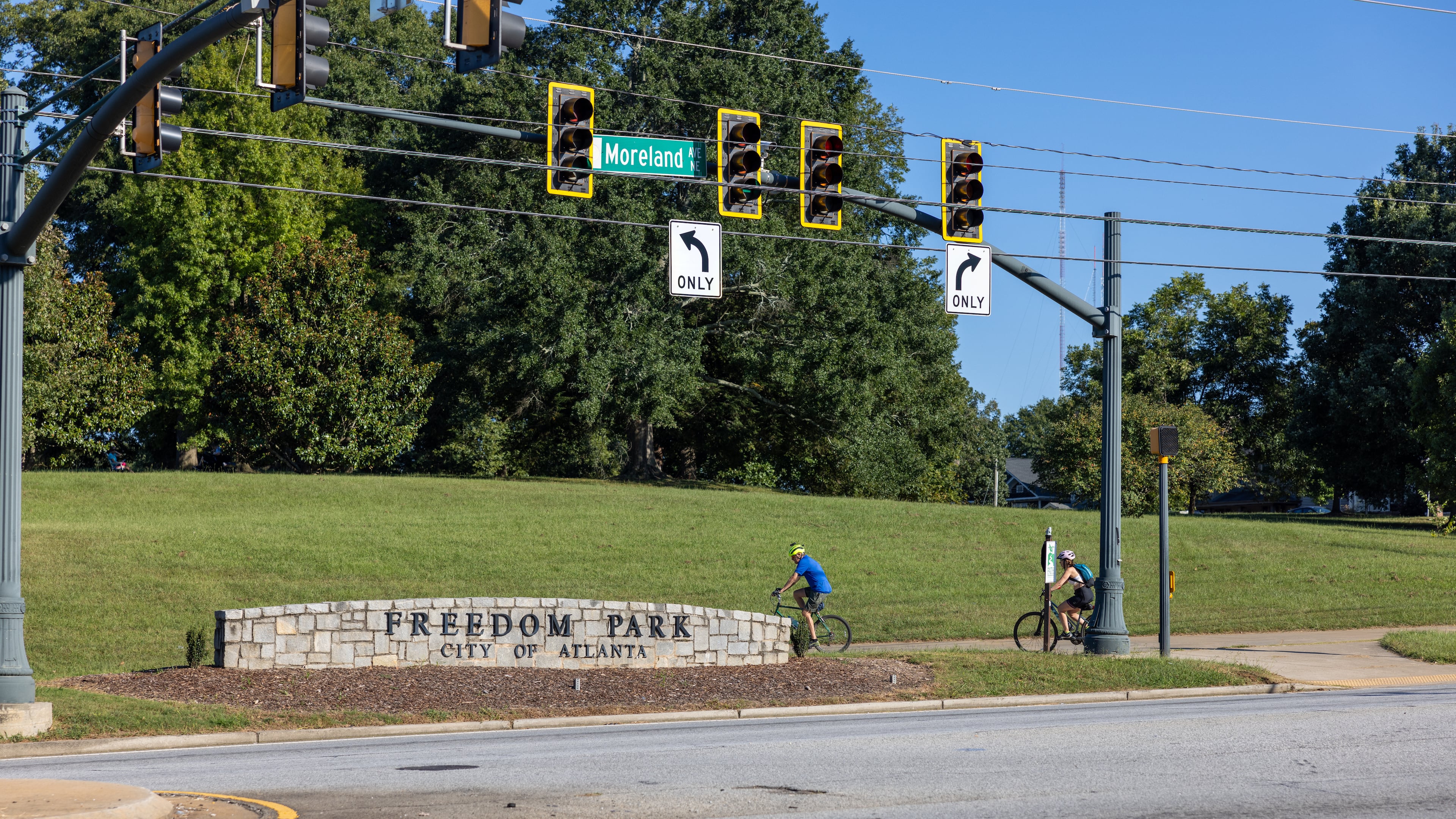 Bikers riding by Freedom Park sign at Poncey-Highland on September 24, 2022