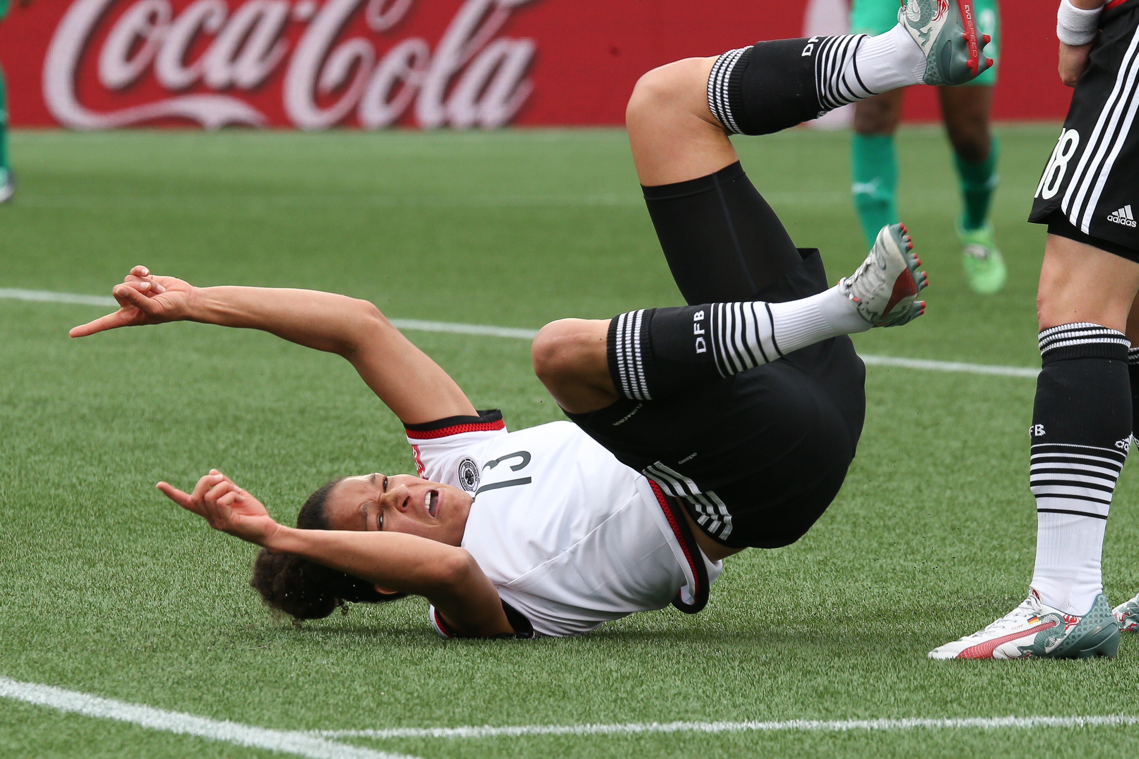 OTTAWA, ON - JUNE 7: Celia Sasic #13 of Germany celebrates a goal as she falls to the ground after connecting on the header against Cote d'Ivoire during the FIFA Women's World Cup Canada 2015 Group B match between Germany and Cote d'Ivoire at Lansdowne Stadium on June 7, 2015 in Ottawa, Canada. (Photo by Andre Ringuette/Getty Images)