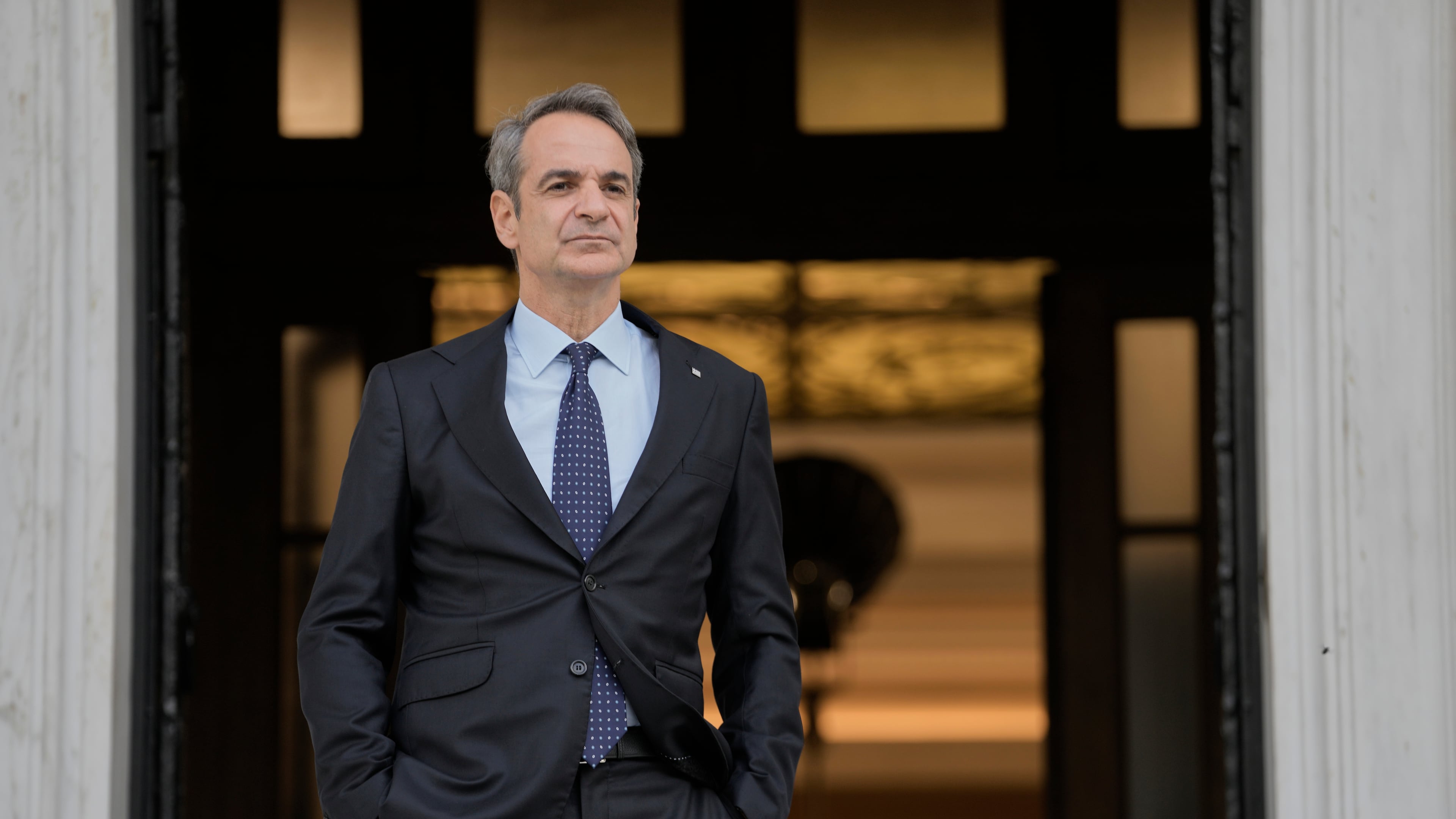 FILE - Greece's Prime Minister Kyriakos Mitsotakis waits for the arrival of the European Parliament president in Athens, April 9, 2025. (AP Photo/Petros Giannakouris)