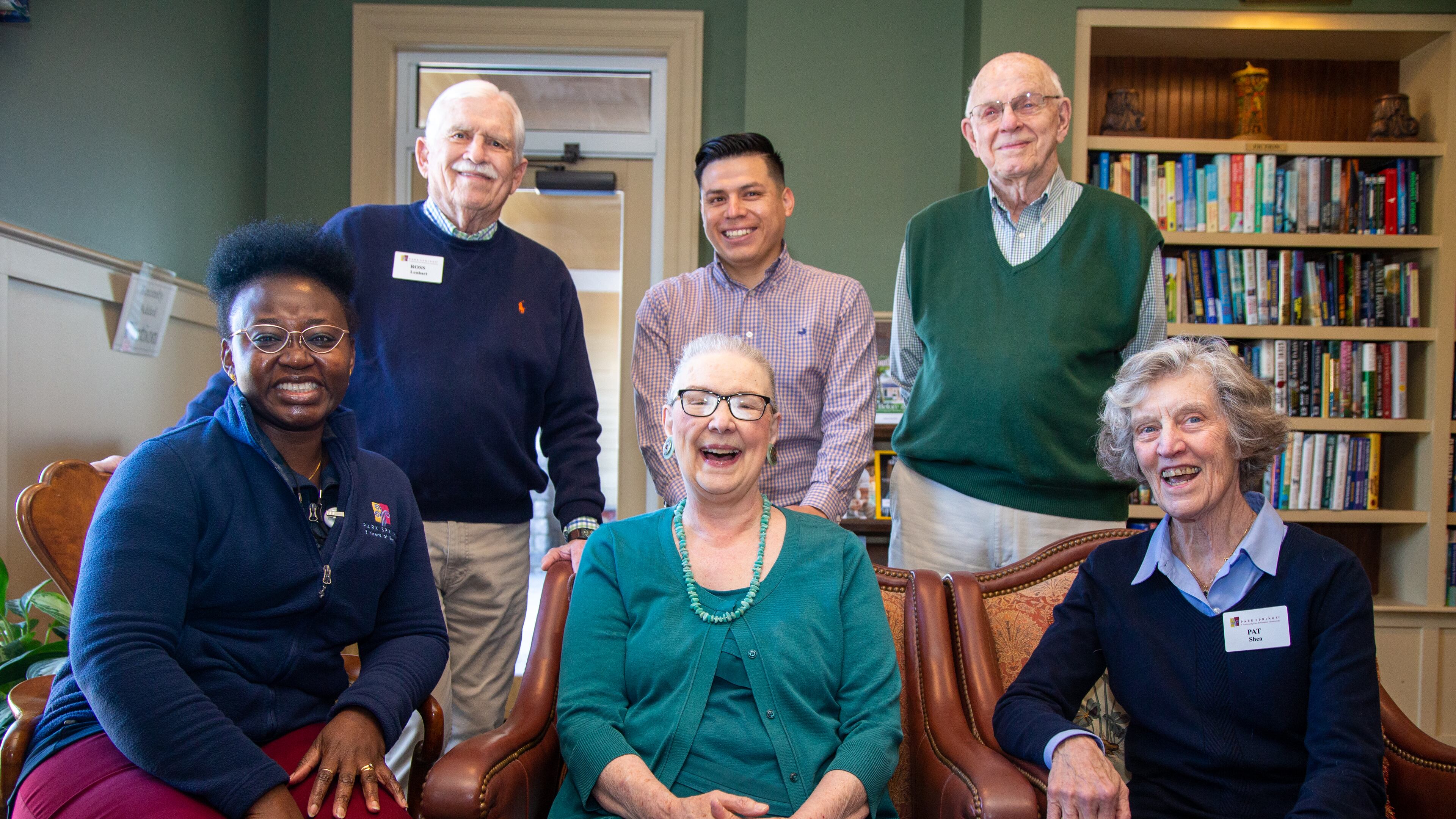Juliet Bakare (counterclockwise from left), Barbara Cooper, Pat Shea, Don Sapit, Jose Pliego and Ross Lenhart pose together in the Park Springs library. Residents of Park Springs, a senior community in Stone Mountain, voluntarily give money to a Foundation that funds college scholarships for employees or their family members. PHIL SKINNER FOR THE ATLANTA JOURNAL-CONSTITUTION.