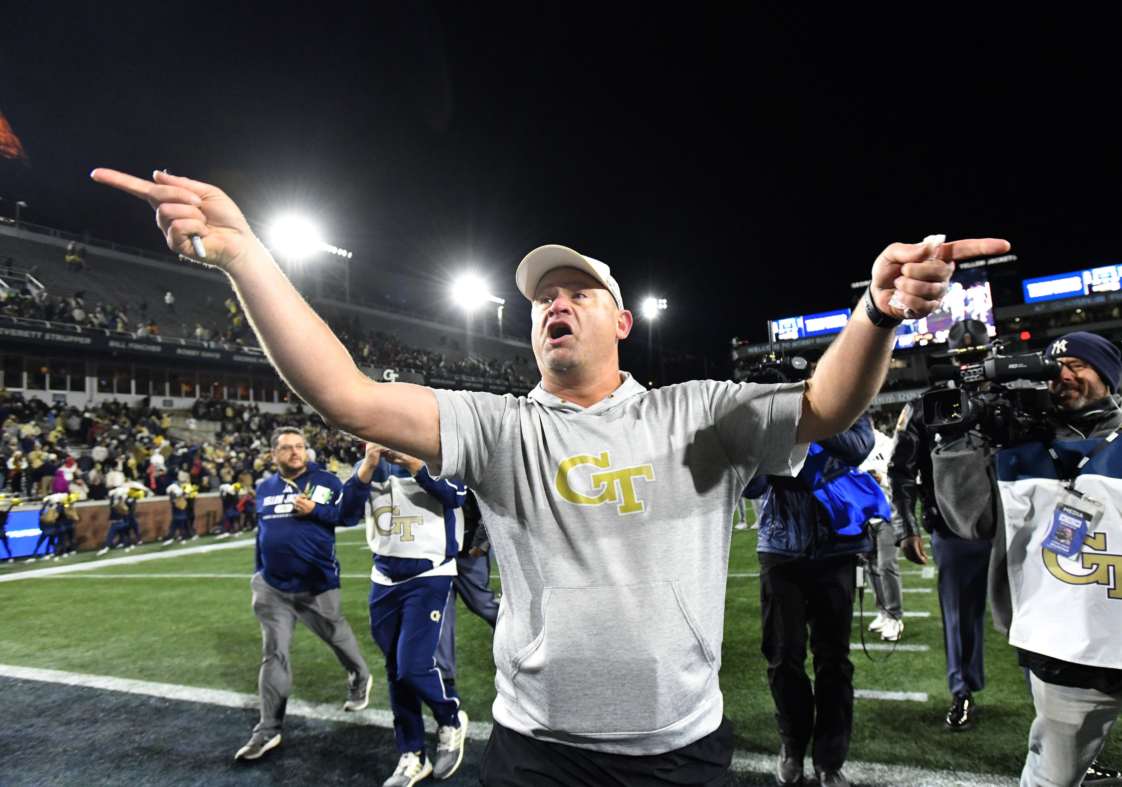 Georgia Tech head coach Brent Key motions to fans as he leaves the field after his team beat North Carolina State 30-29 at Bobby Dodd Stadium, Thursday, November 21, 2024, in Atlanta. (Hyosub Shin / AJC)