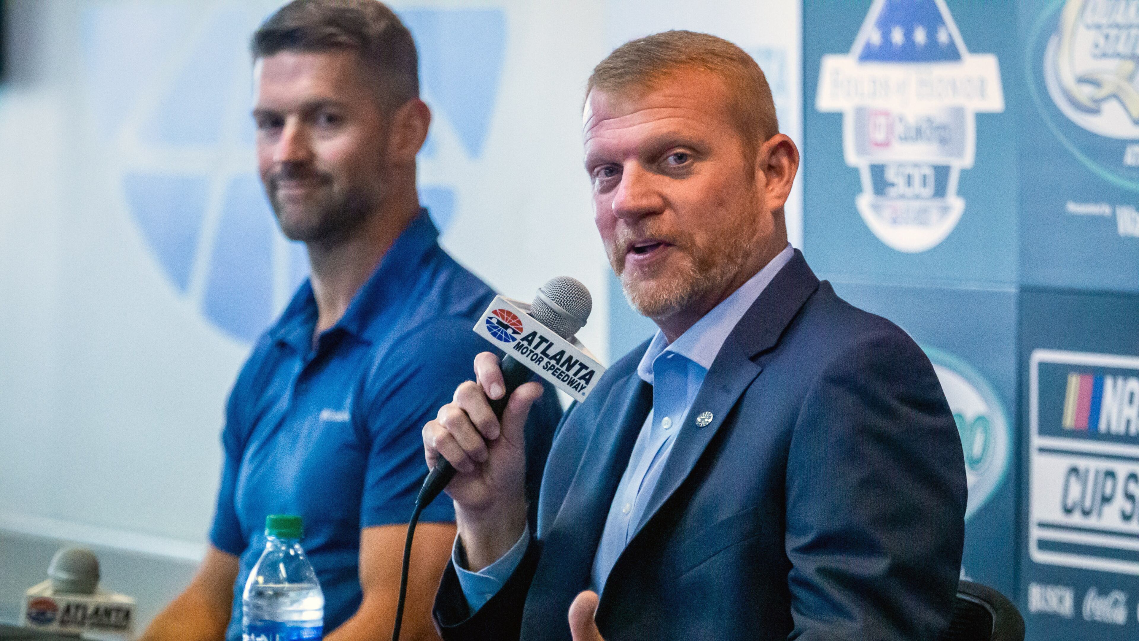 Brandon Hutchison (R) sits next to Steve Swift during a press conference at Atlanta Motor Speedway in Hampton Tuesday, July 6, 2021. (STEVE SCHAEFER/The Atlanta Journal-Constitution)