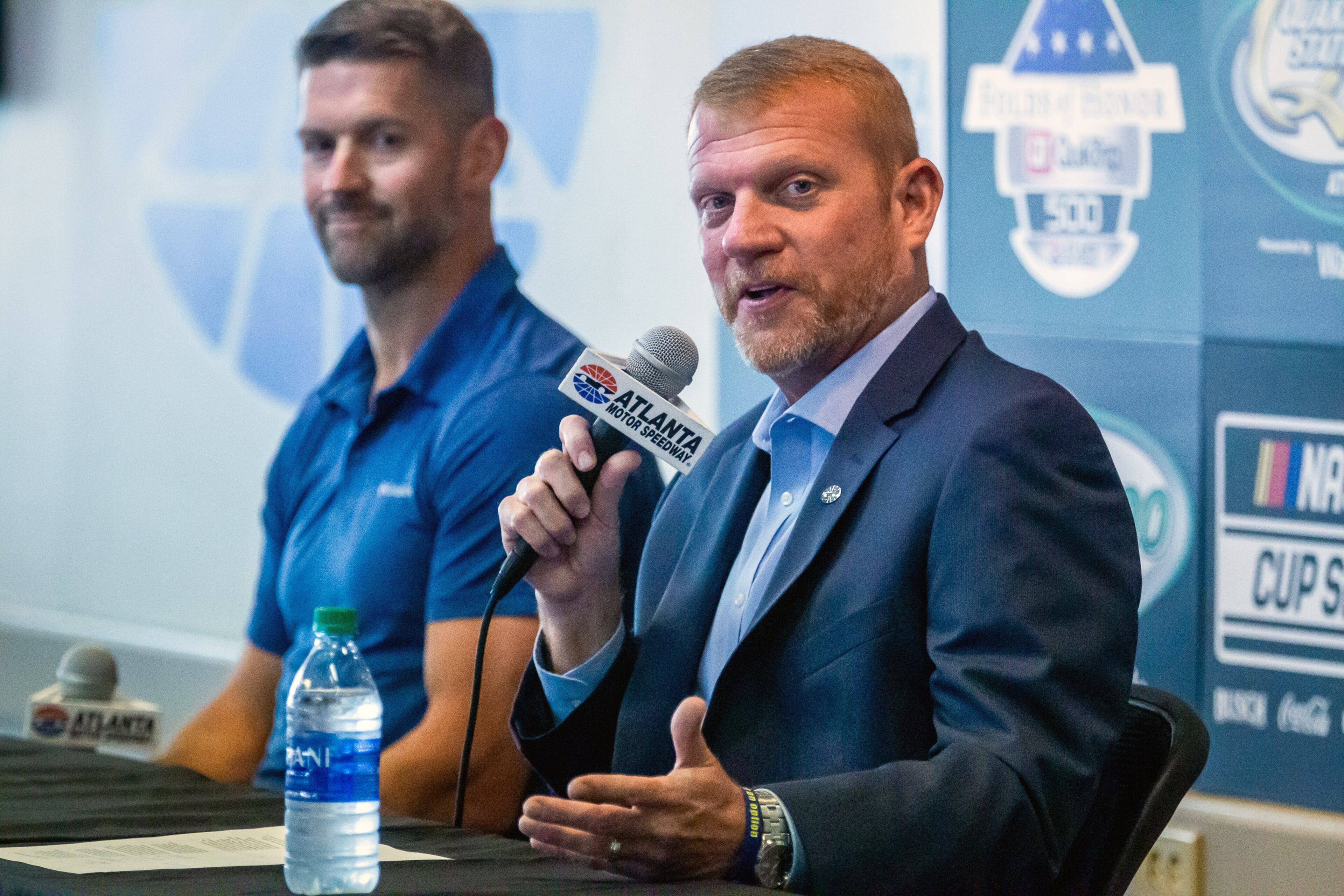 Brandon Hutchison (right) sits next to Steve Swift during a press conference at Atlanta Motor Speedway in Hampton Tuesday, July 6, 2021. STEVE SCHAEFER FOR THE ATLANTA JOURNAL-CONSTITUTION