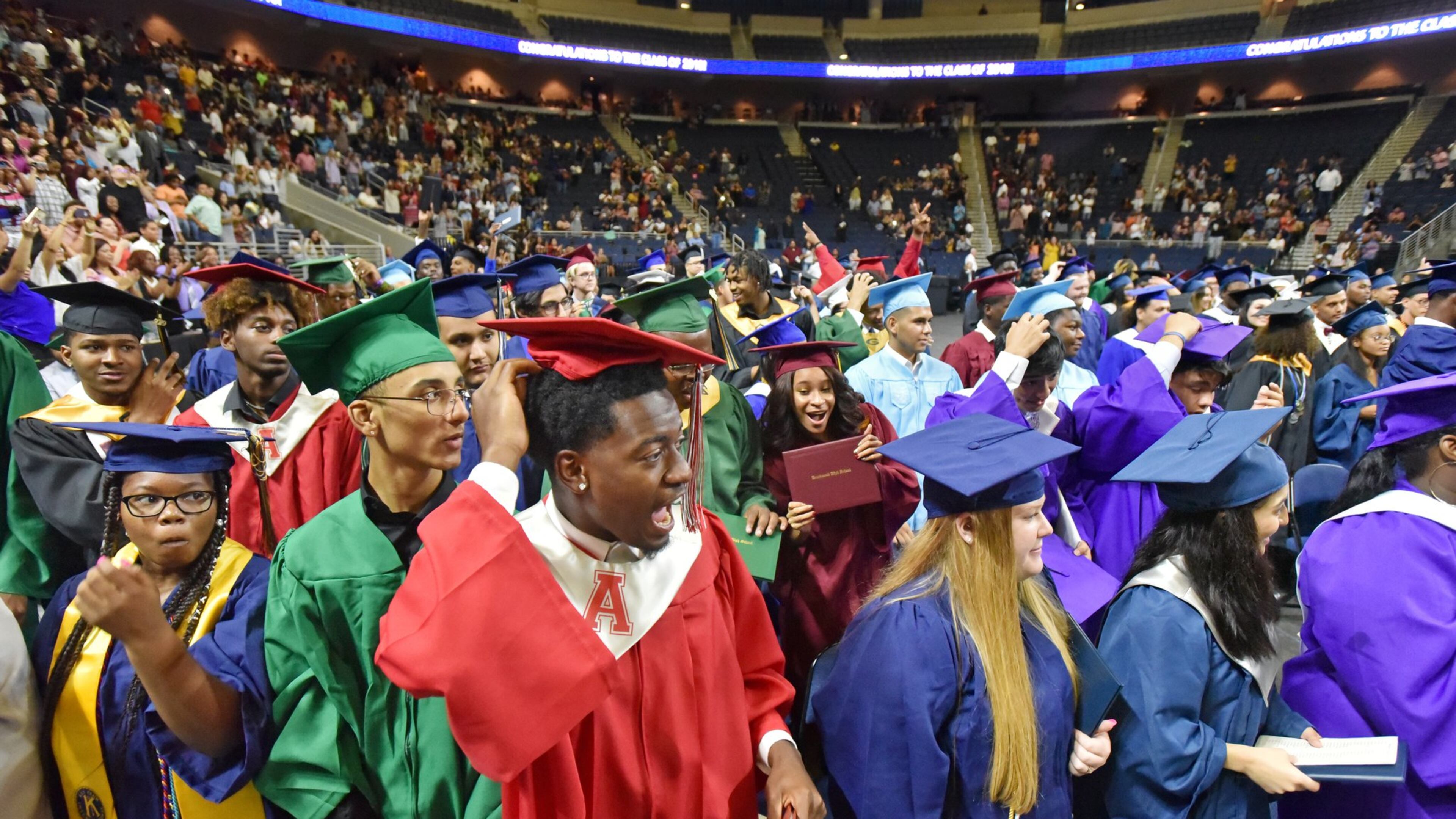 Students from Gwinnett County high schools react after they moved their tassels during 2019 Gwinnett County Public Schools summer school graduation at Infinite Energy Arena on July 3, 2019. The school district has suspended the requirement that students pass the Gateway exams to receive diplomas. HYOSUB SHIN / HYOSUB.SHIN@AJC.COM