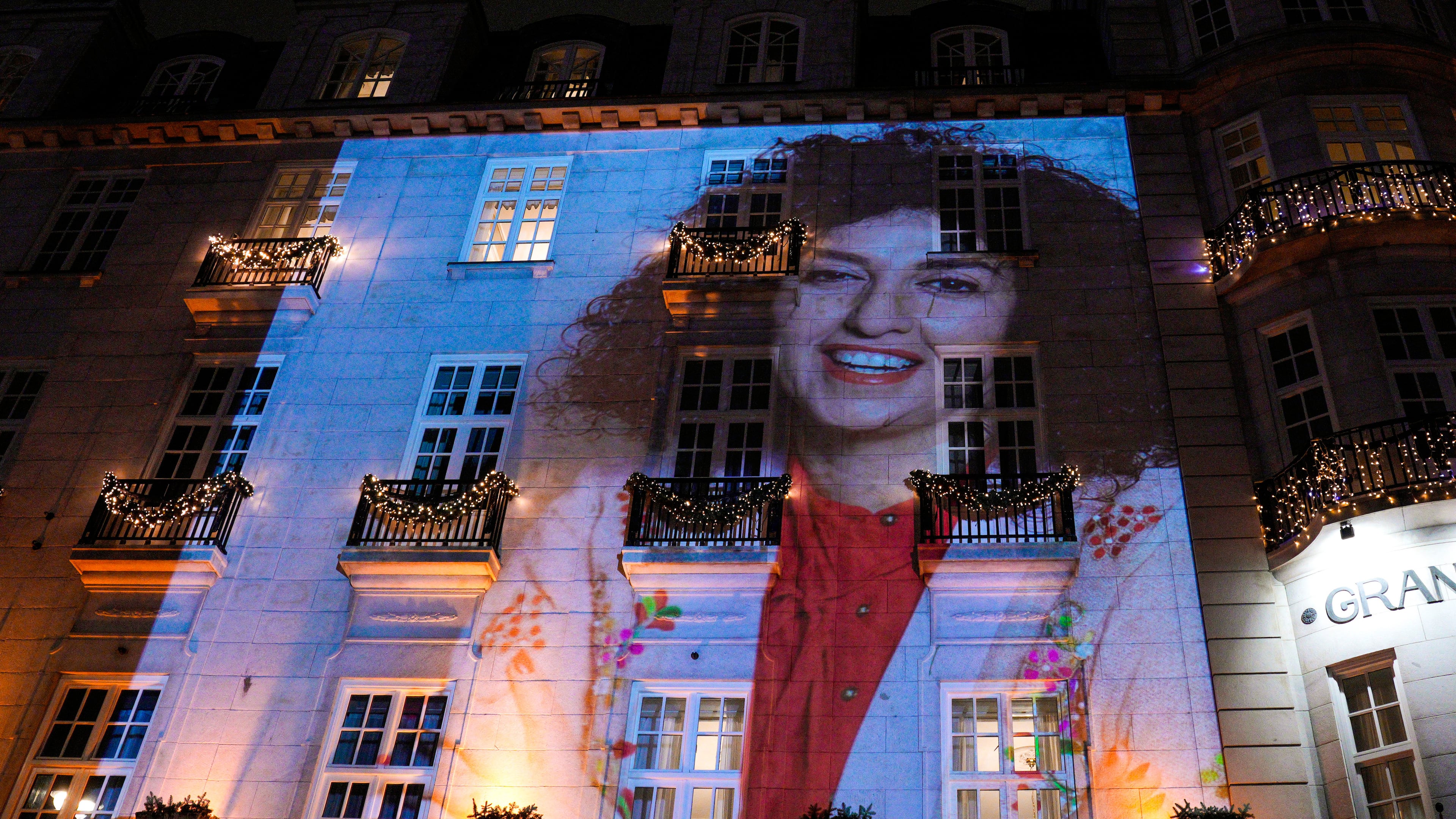 A photo of Nobel Peace Prize recipient Narges Mohammadi is projected on the wall of the Grand Hotel in central Oslo before the Nobel banquet on Sunday, Dec. 10. 2023. (Javad Parsa/NTB Scanpix via AP)