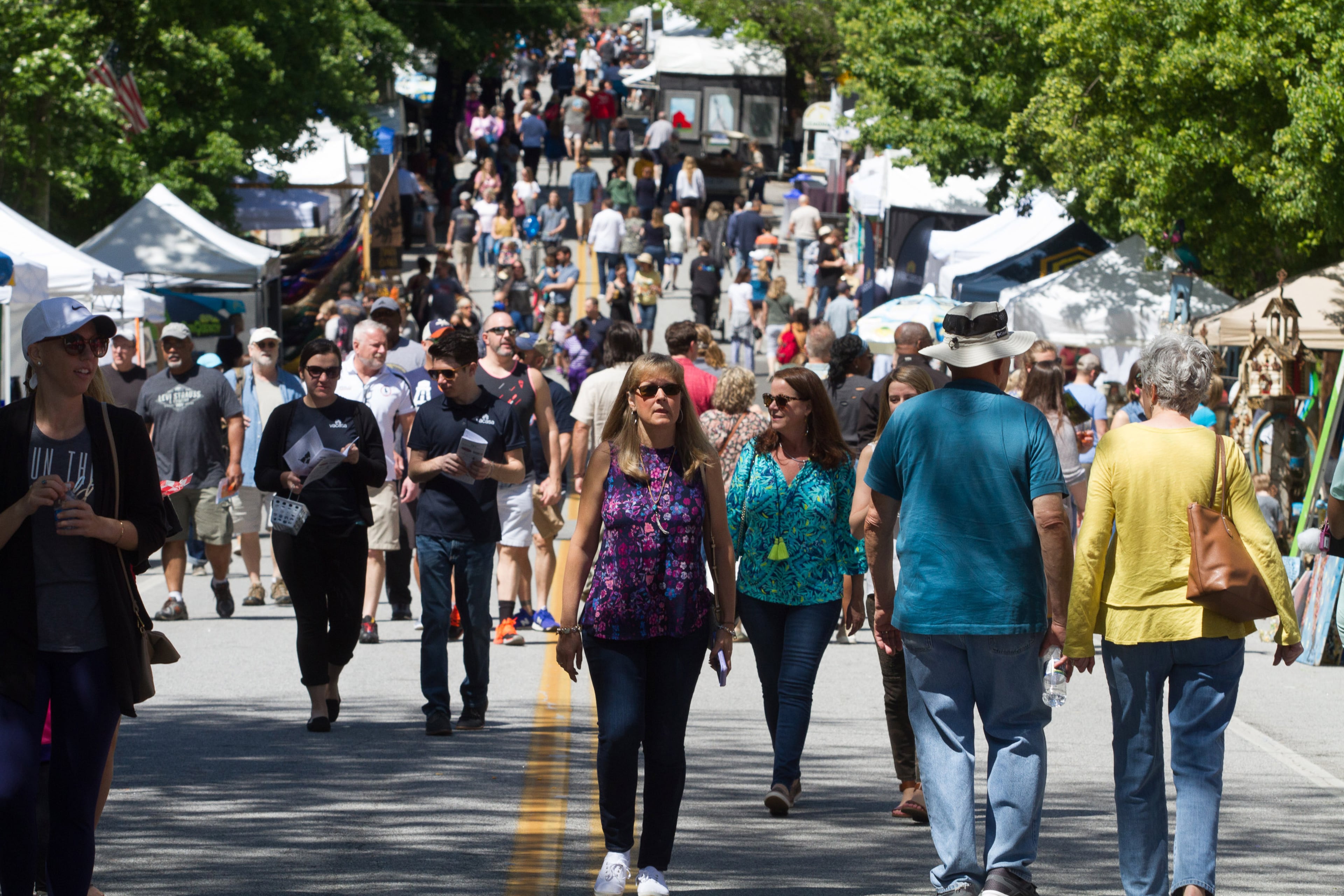 A large crowd checks out the booths feauring artists and other vendors during the 47th Inman Park Spring Festival on Sunday, April 29, 2018. The event was held Saturday and Sunday in the Atlanta neighborhood.