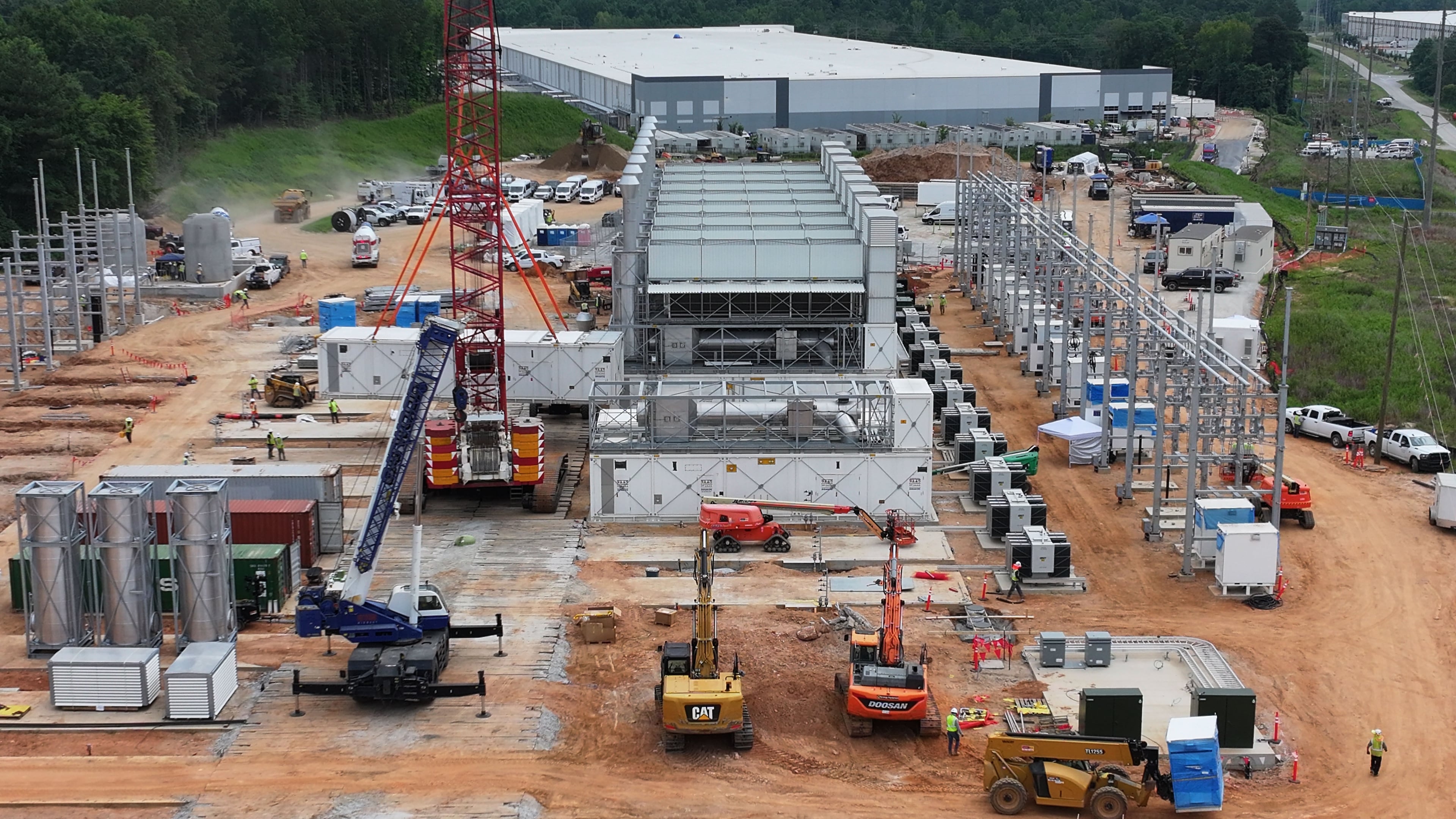 An aerial view shows off-grid generators being installed in front of a data center in Covington on Thursday, June 25, 2026. (Hyosub Shin/AJC)