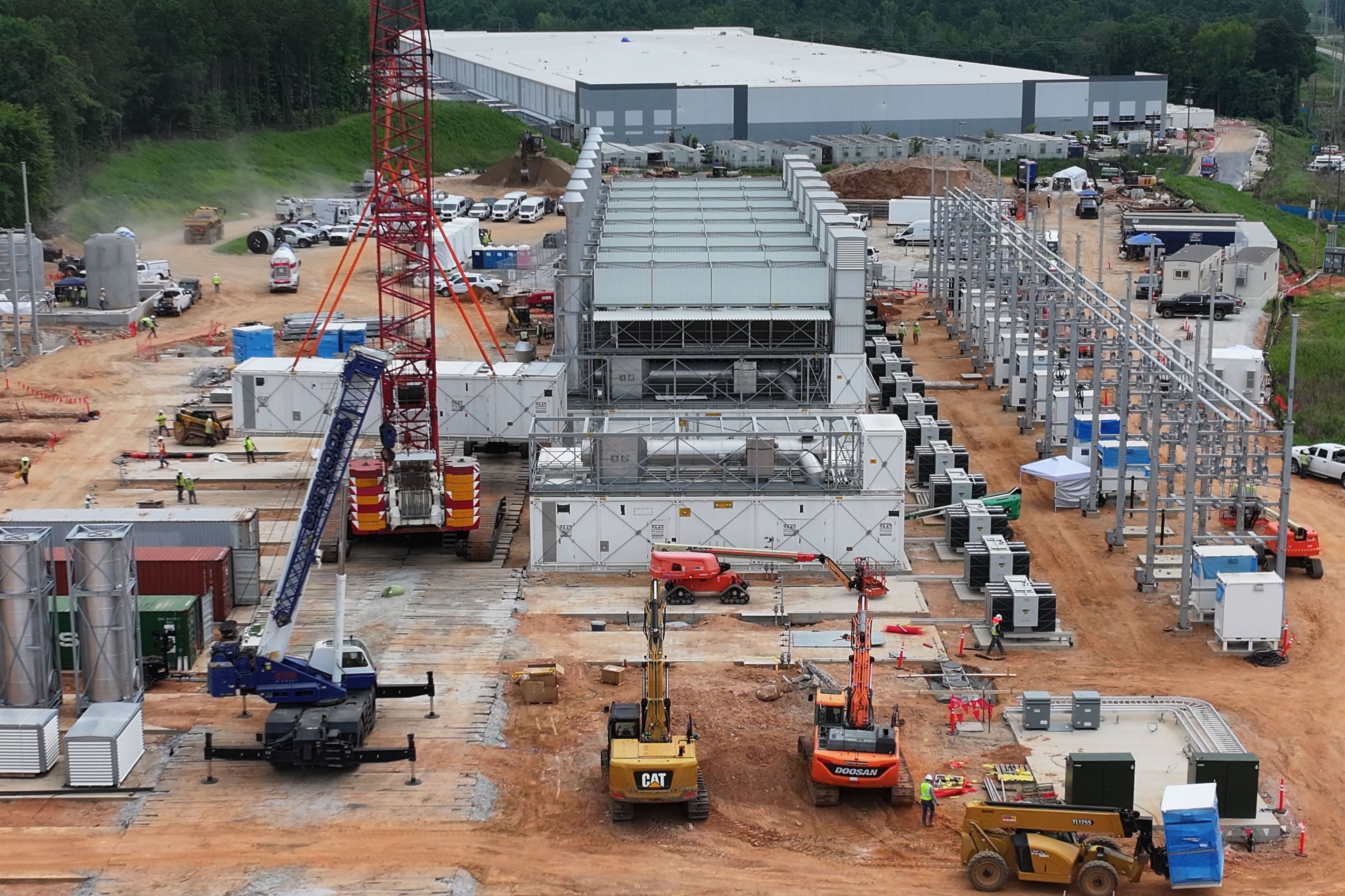 An aerial view shows off-grid generators being installed in front of a data center in Covington on Thursday, June 25, 2026. (Hyosub Shin/AJC)