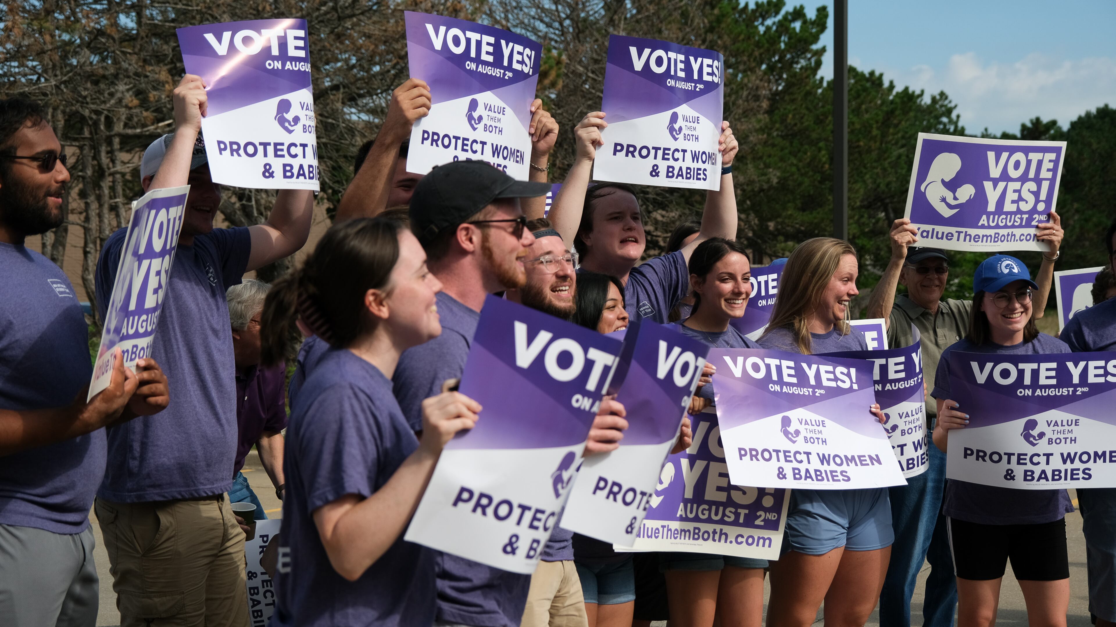 Supporters of the group Value Them Both, who support Amendment 2, in Shawnee, Kan., July 30, 2022. Millions of dollars’ worth of advertising has flooded the airwaves in Kansas, part of a sudden burst of attention and spending as voters prepare for the country’s first electoral test addressing abortion since the Supreme Court struck down Roe v. Wade. (Arin Yoon/The New York Times)