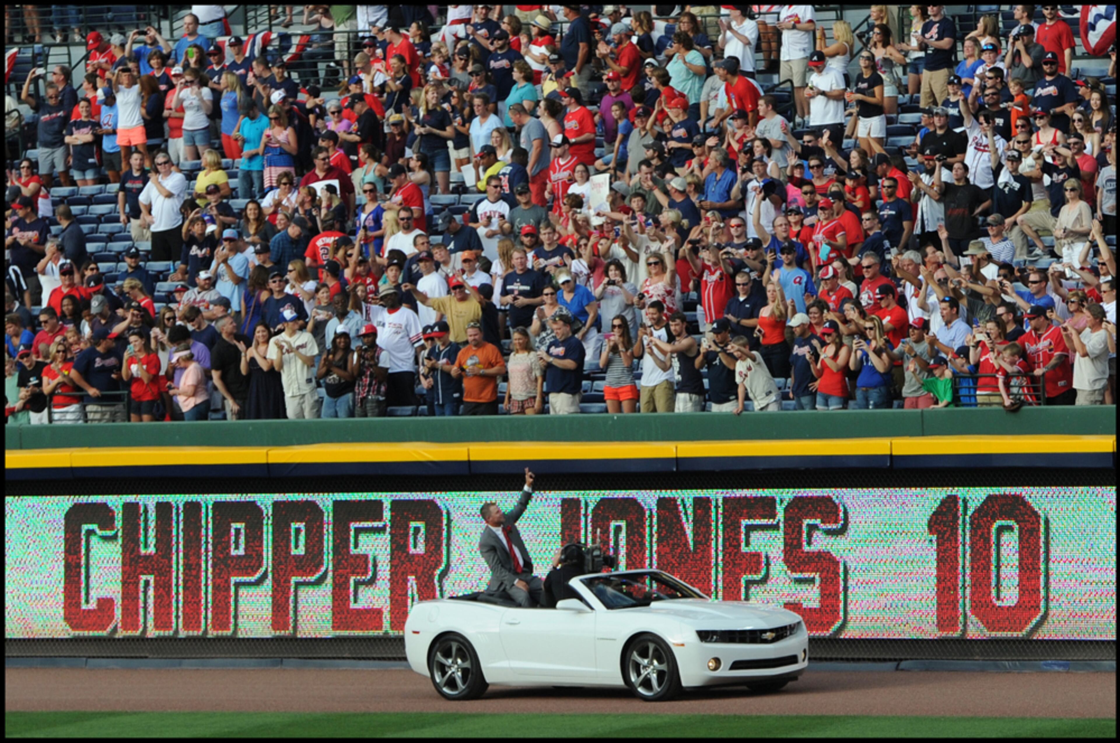 June 28, 2013 -ATLANTA: Best photo of Chipper Jones retirement ceremony at Turner Stadium. Chipper Jones waves to fans while being driven around the field in a car after the ceremony to retire his number 10 at Turner Field on Friday, June 28, 2013. Camera Nikon D3s, Lens 70 to 200mm f2.8, ISO 640, Aperture f5.6, Shutter speed 1/2500. JOHNNY CRAWFORD / JCRAWFORD@AJC.COM
