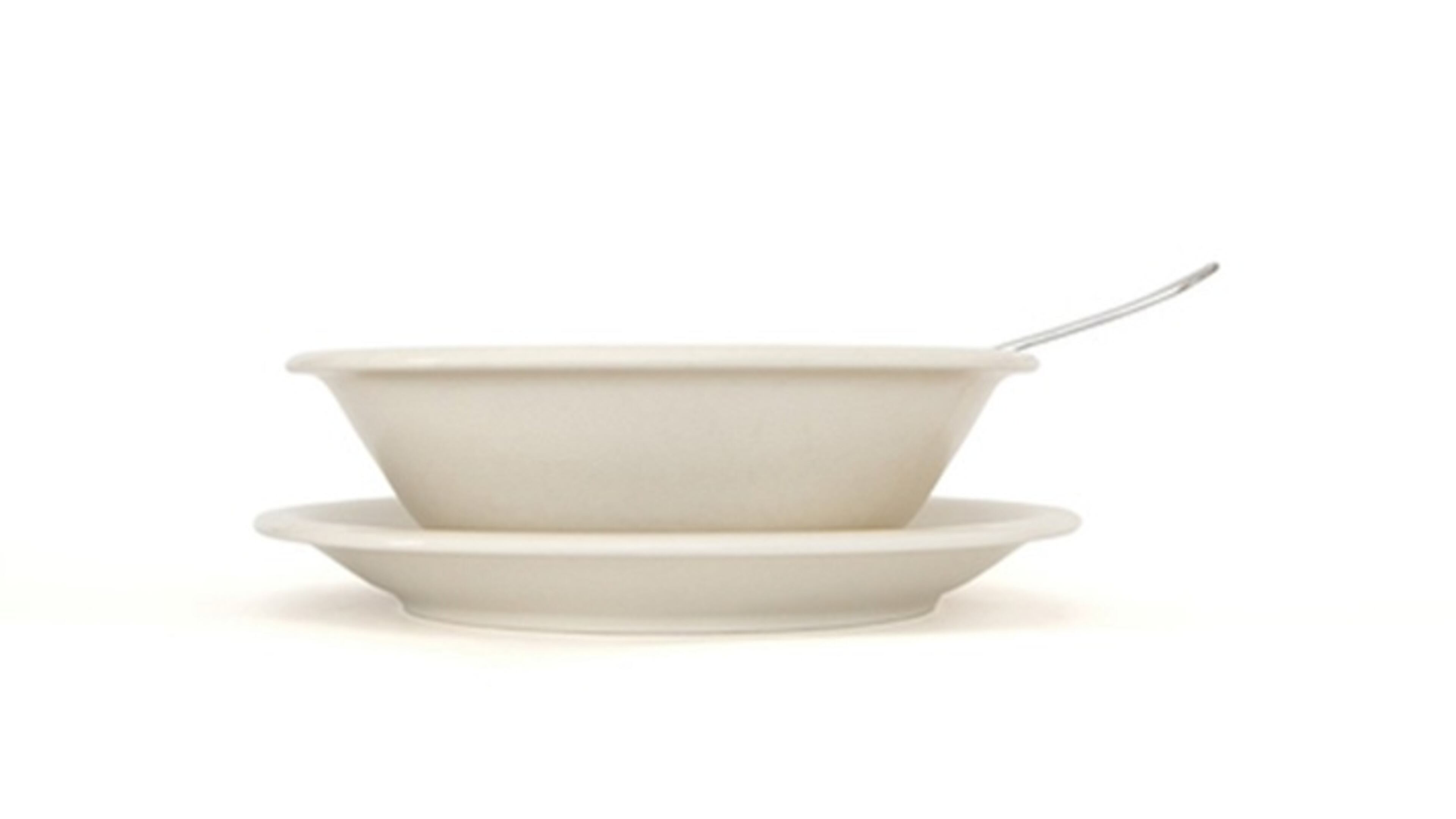 Beige soup plate with spoon and saucer side view (Dreamstime/TNS)