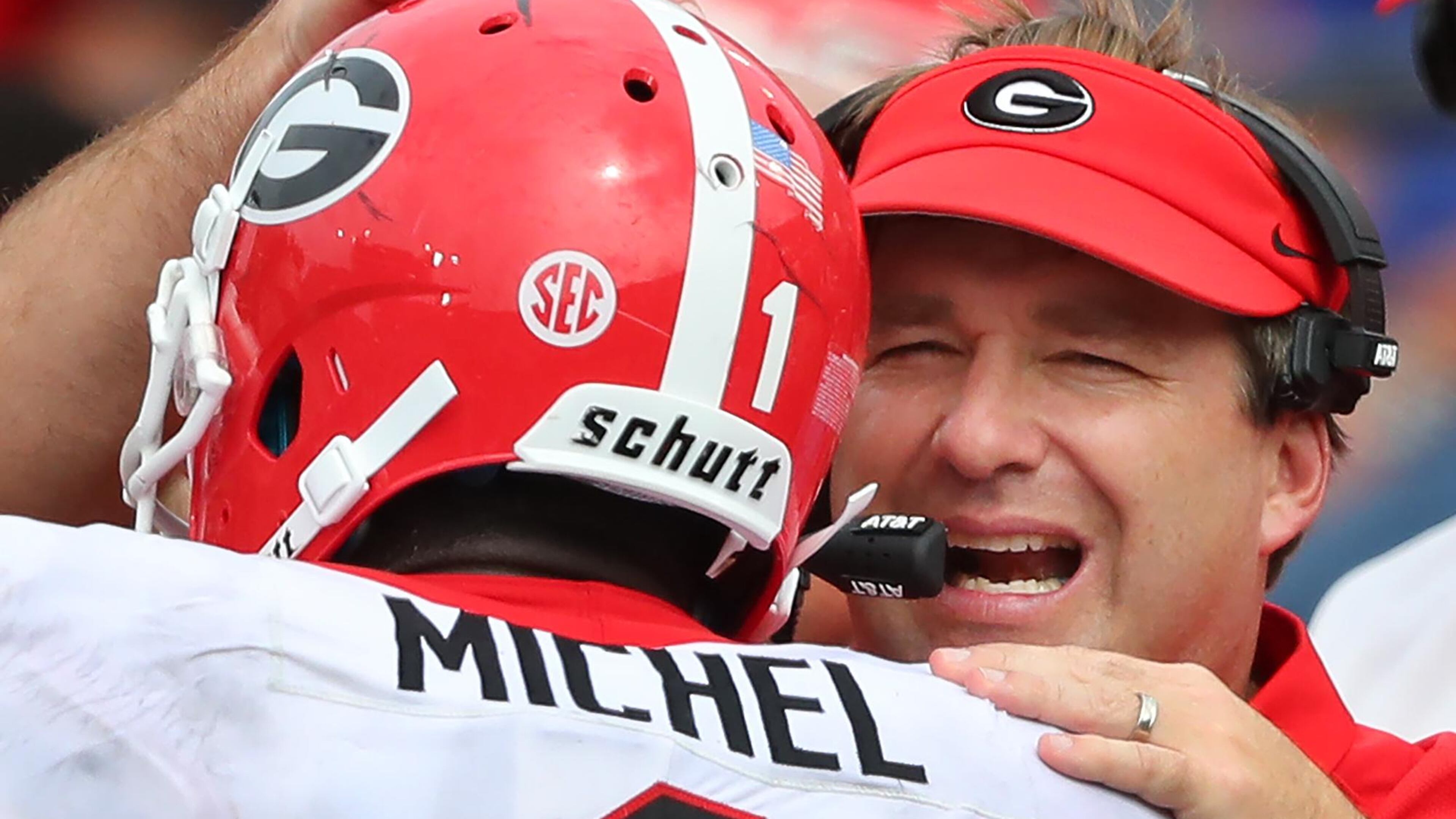 Georgia head coach Kirby Smart gives tailback Sony Michel a pat on the helmet after his long touchdown run against Vanderbilt. Curtis Compton/ccompton@ajc.com