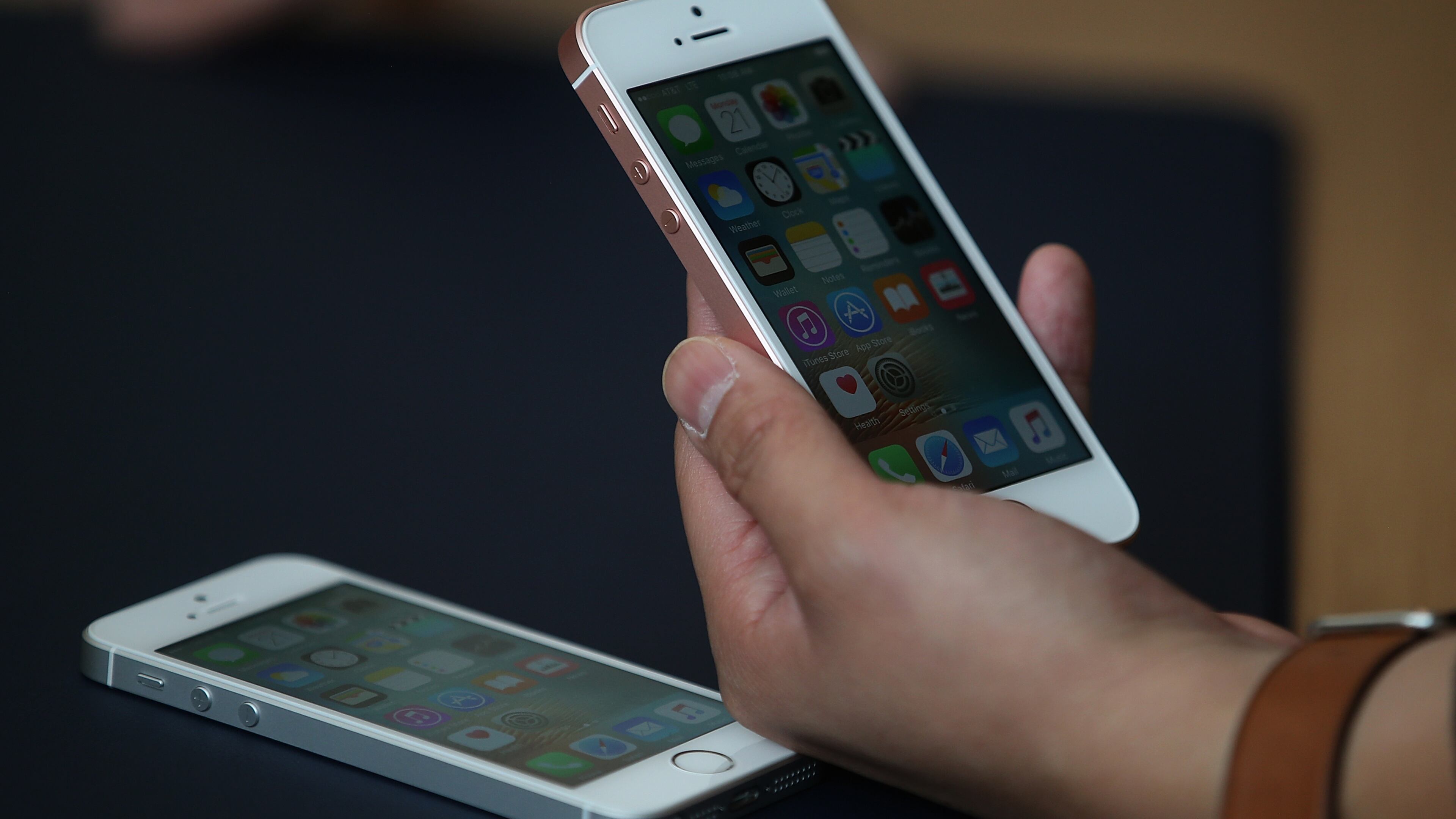 A person checks out the new iPhone SE during an Apple special event at the Apple headquarters in Cupertino, California.
