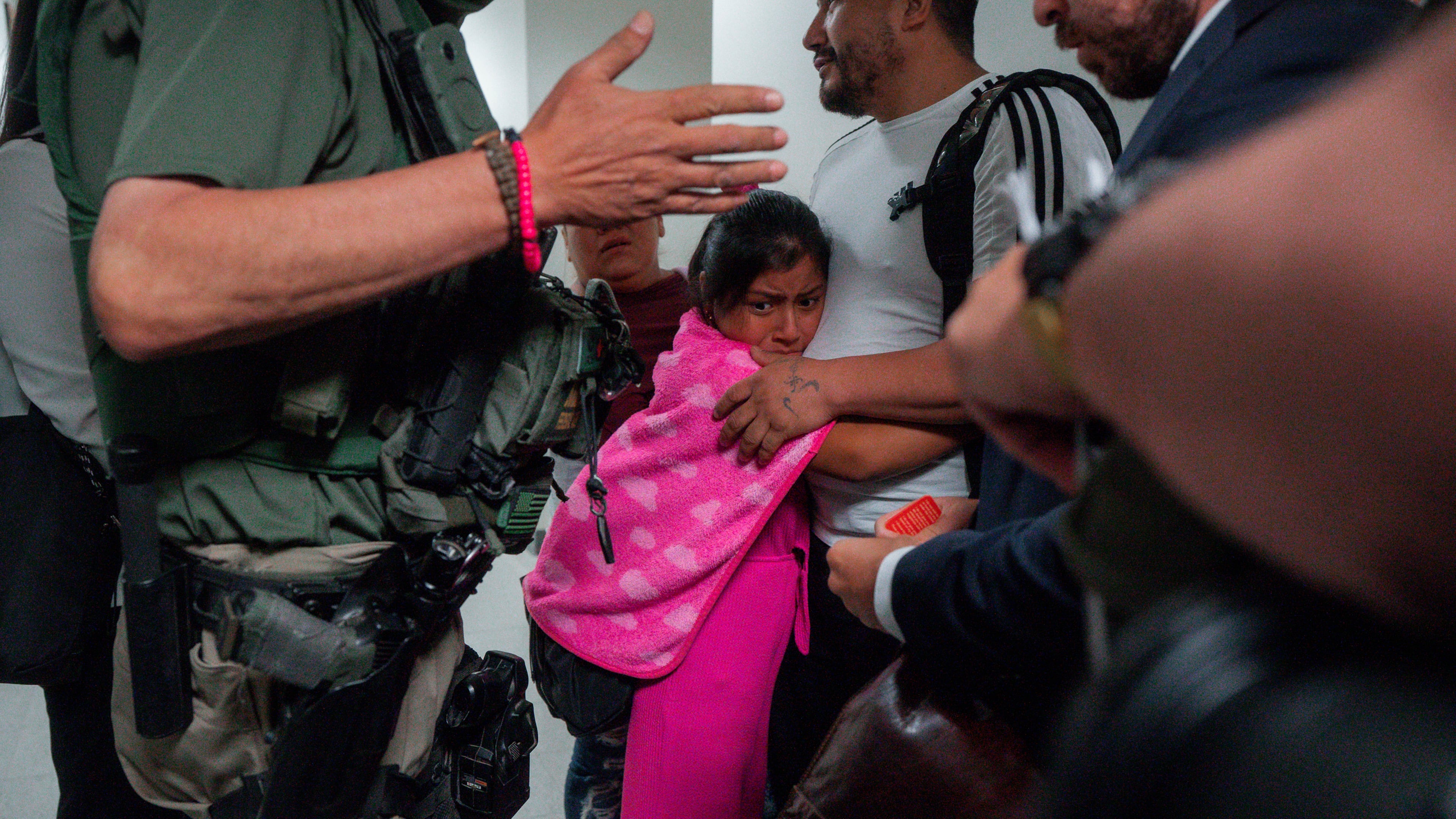 FILE - An asylum seeker from Ecuador hugs her father as he is detained by federal agents, July 31, 2025, in New York. (AP Photo/Olga Fedorova, file)