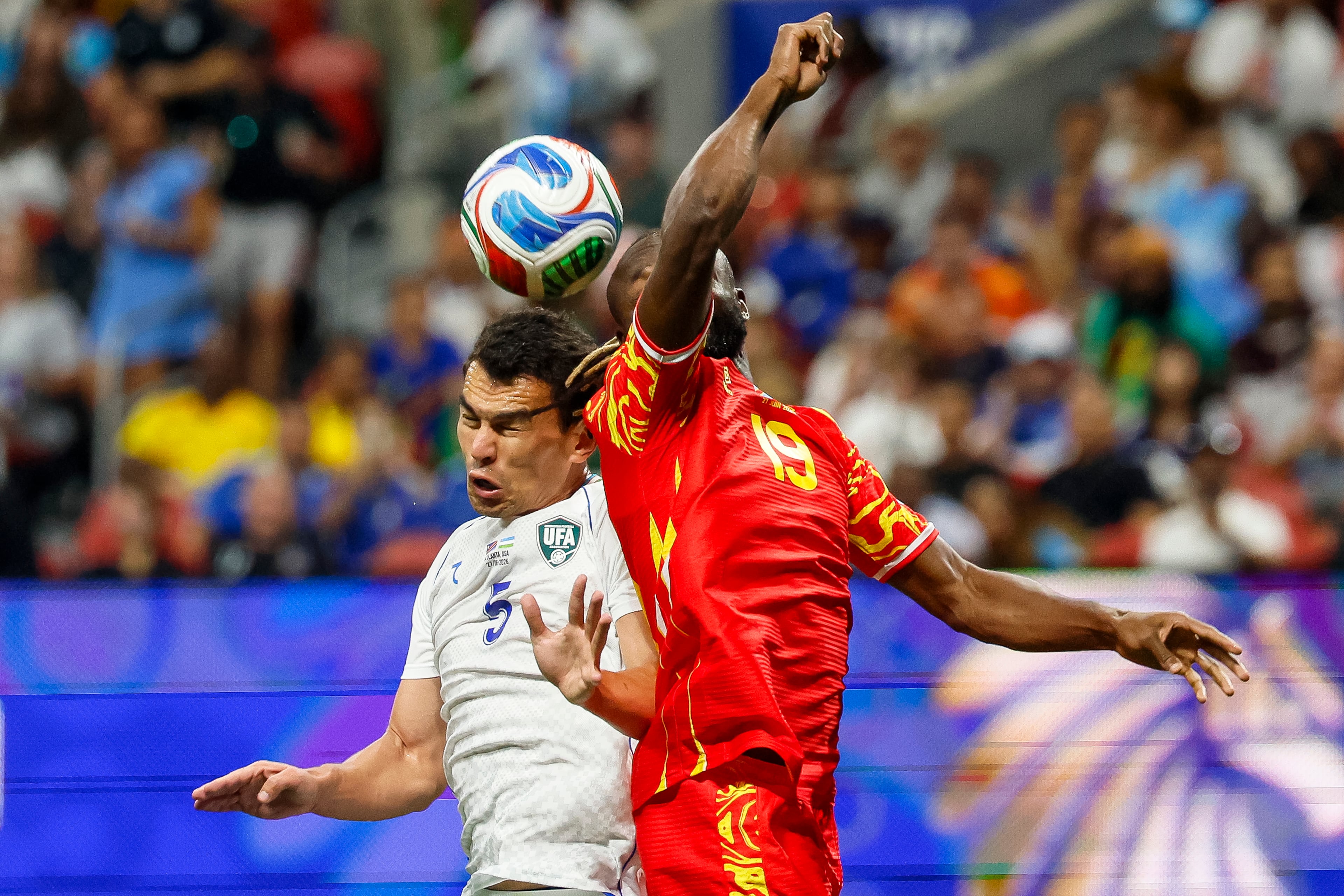 Uzbekistan defender Rustam Ashurmatov (left) and Congo forward Fiston Mayele (right) collide during the first half of a FIFA World Cup match at Atlanta Stadium (Mercedes-Benz Stadium) on Saturday, June 27, 2026, in Atlanta. (Miguel Martinez/AJC)