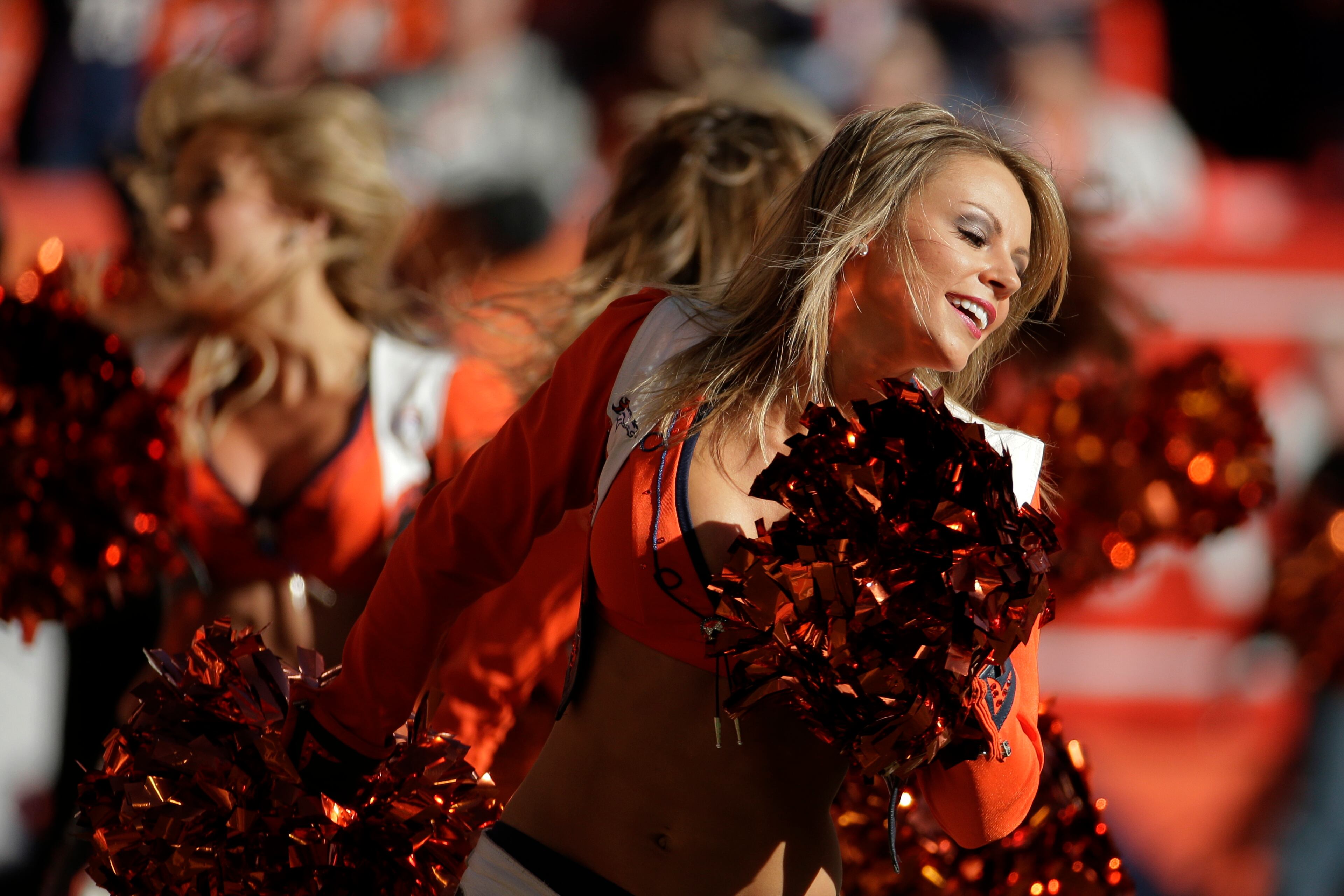 The Denver Broncos cheerleaders perform during the first half of the AFC Championship NFL playoff football game in Denver on Jan. 19, 2014.