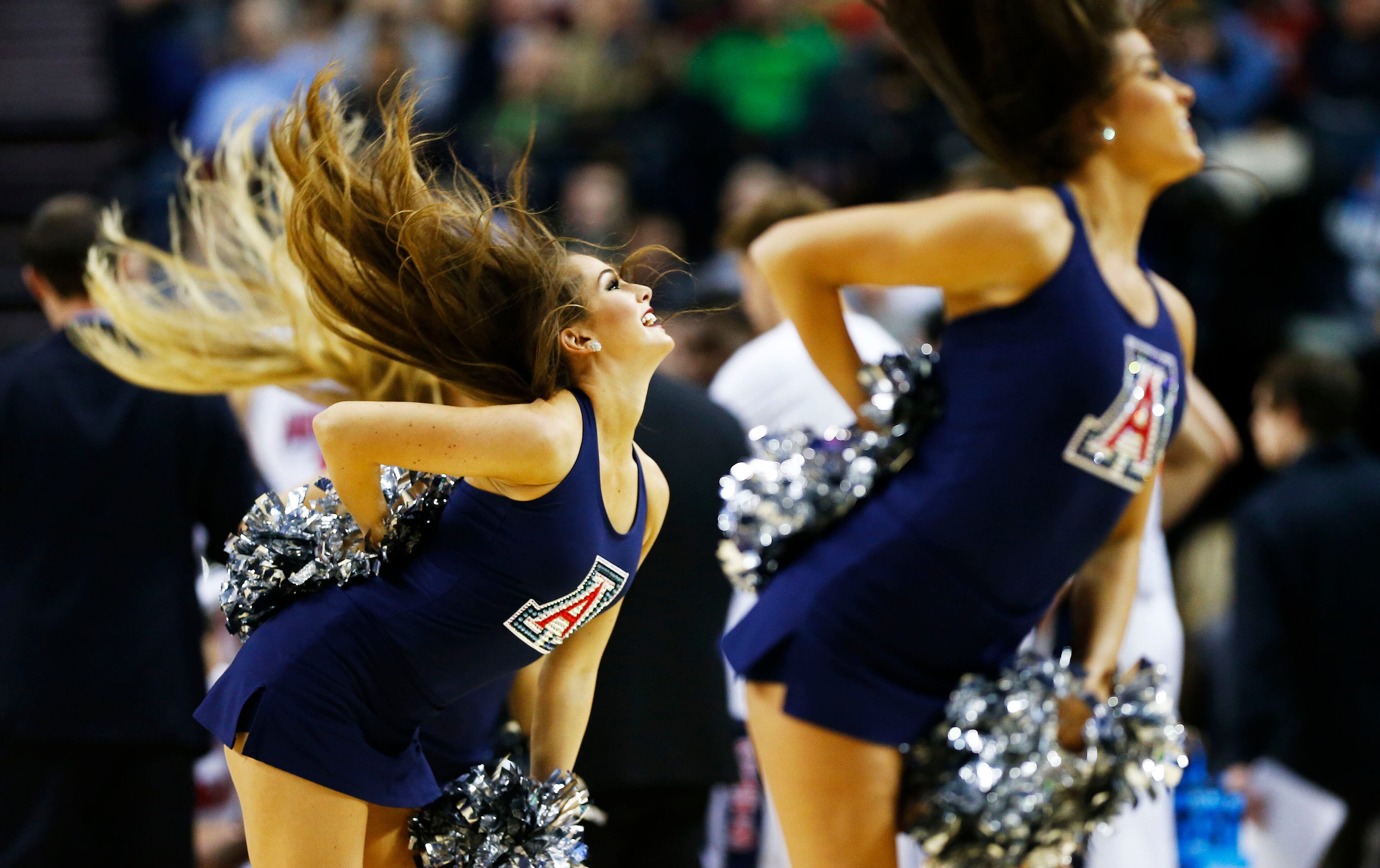 PORTLAND, OR - MARCH 21: Arizona Wildcats cheerleaders perform in the first half against the Ohio State Buckeyes during the third round of the 2015 NCAA Men's Basketball Tournament at Moda Center on March 21, 2015 in Portland, Oregon. (Photo by Jonathan Ferrey/Getty Images)