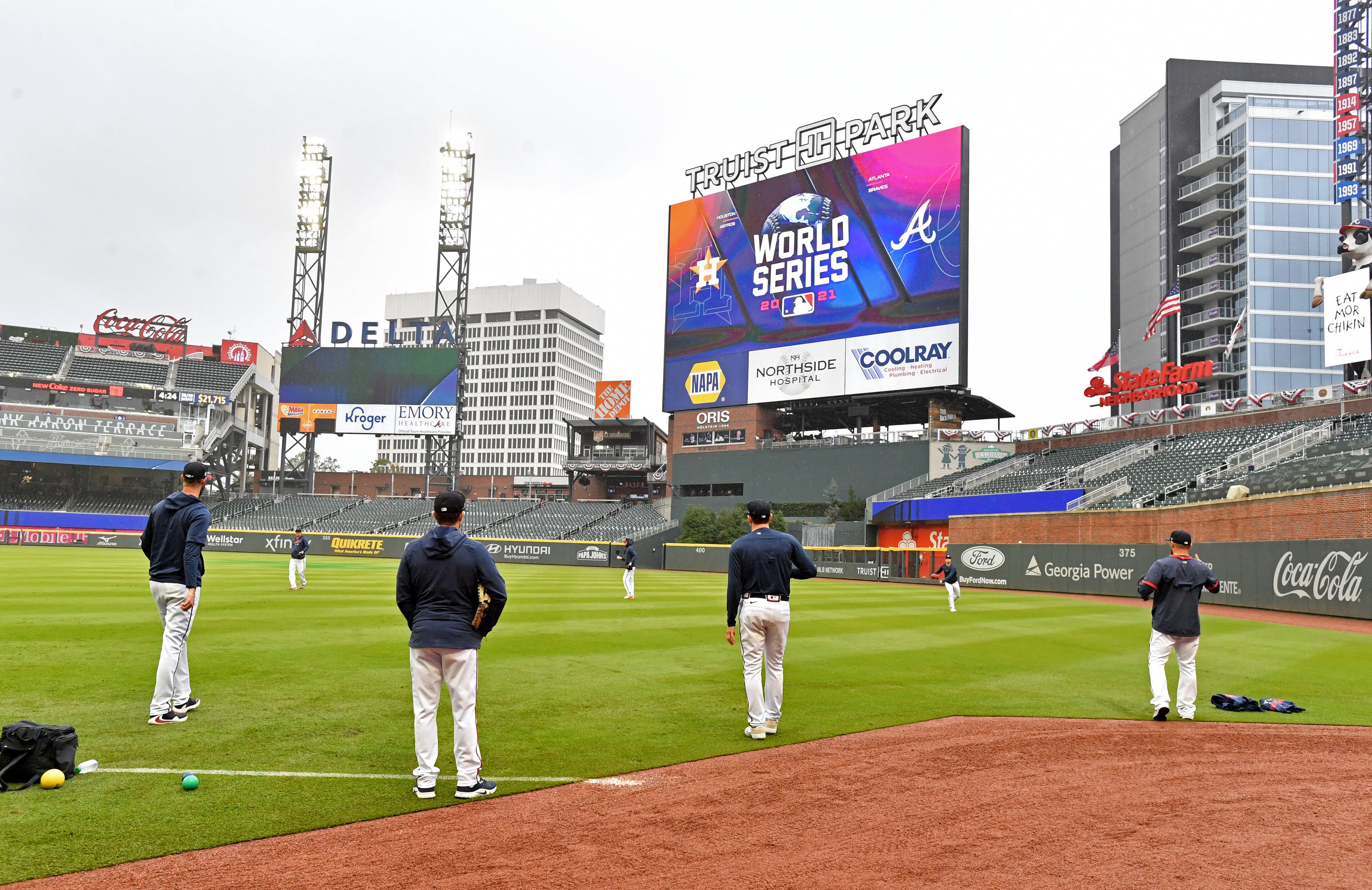 Atlanta Braves pitchers work out in the rain prior to Game 4 of baseball's World Series against Houston Astros at Truist Park in Atlanta on Saturday, October 30, 2021. (Hyosub Shin / Hyosub.Shin@ajc.com)