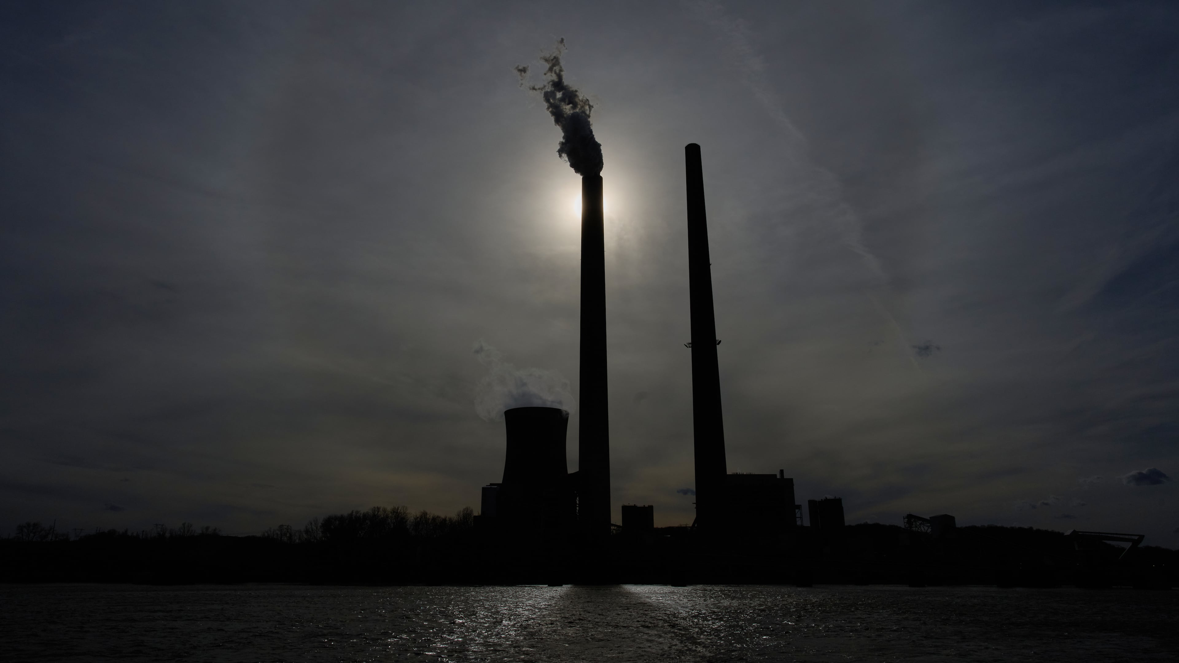 The Mountaineer Power Plant, a coal-fired power plant near New Haven, W.Va., is seen across the Ohio River from Racine, Ohio, Friday, March 13, 2026. (AP Photo/Carolyn Kaster)