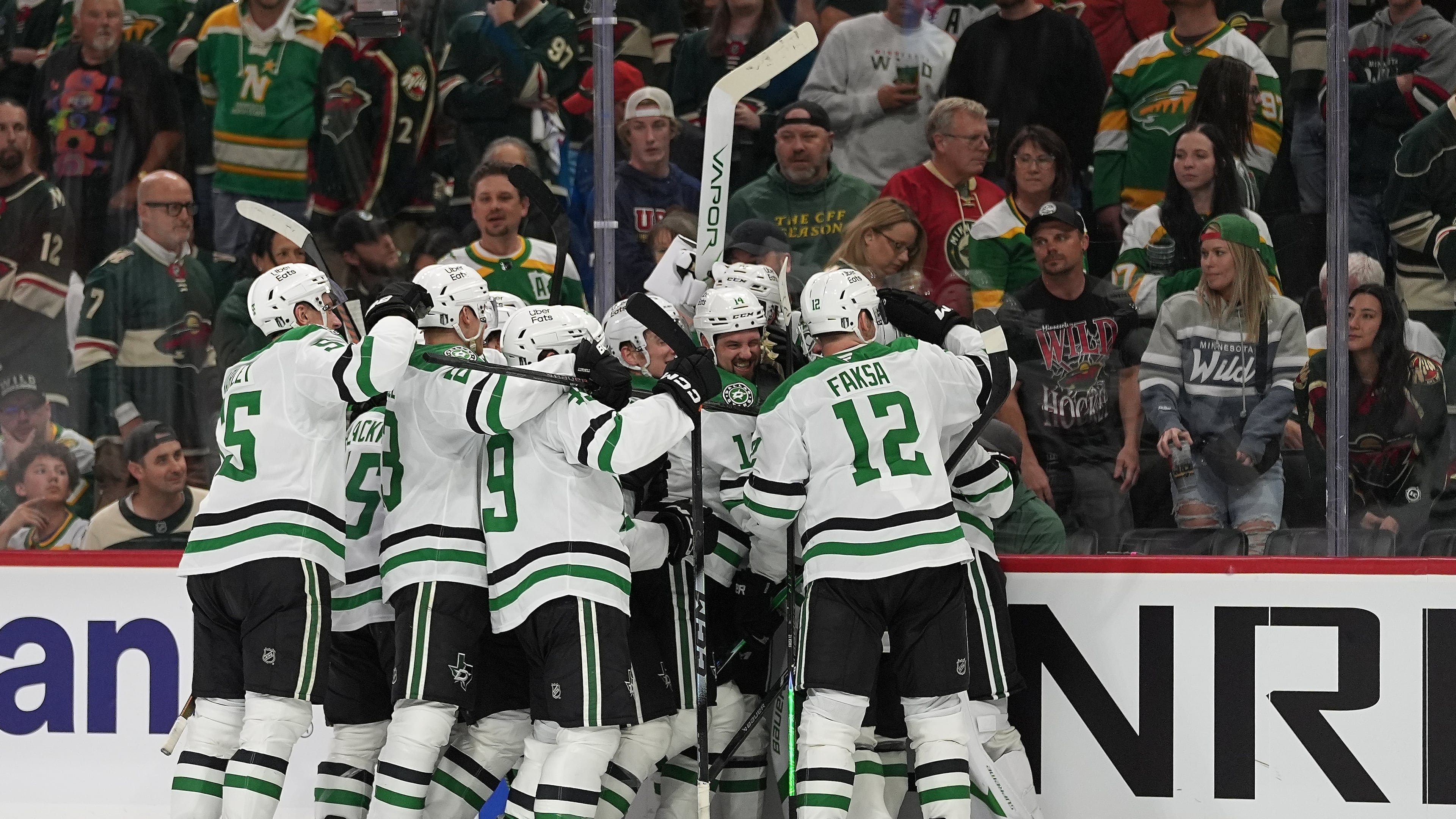 Dallas Stars players celebrate after the double overtime win against the Minnesota Wild of Game 3 in the first round of the NHL Stanley Cup hockey playoffs early morning Thursday, April 23, 2026, in St. Paul, Minn. (AP Photo/Abbie Parr)