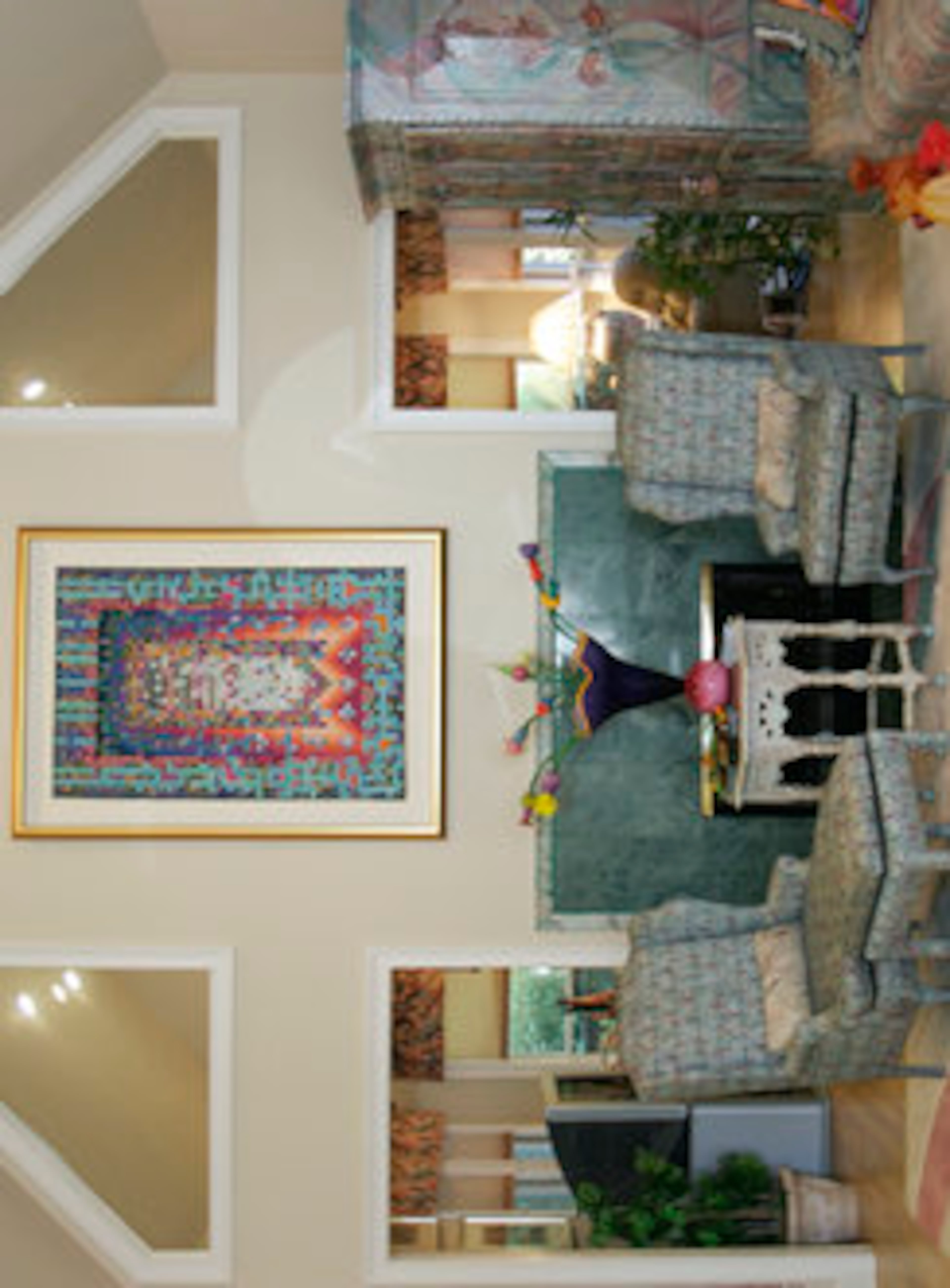 The area rug in the great room reflects the pattern on the front window and door.