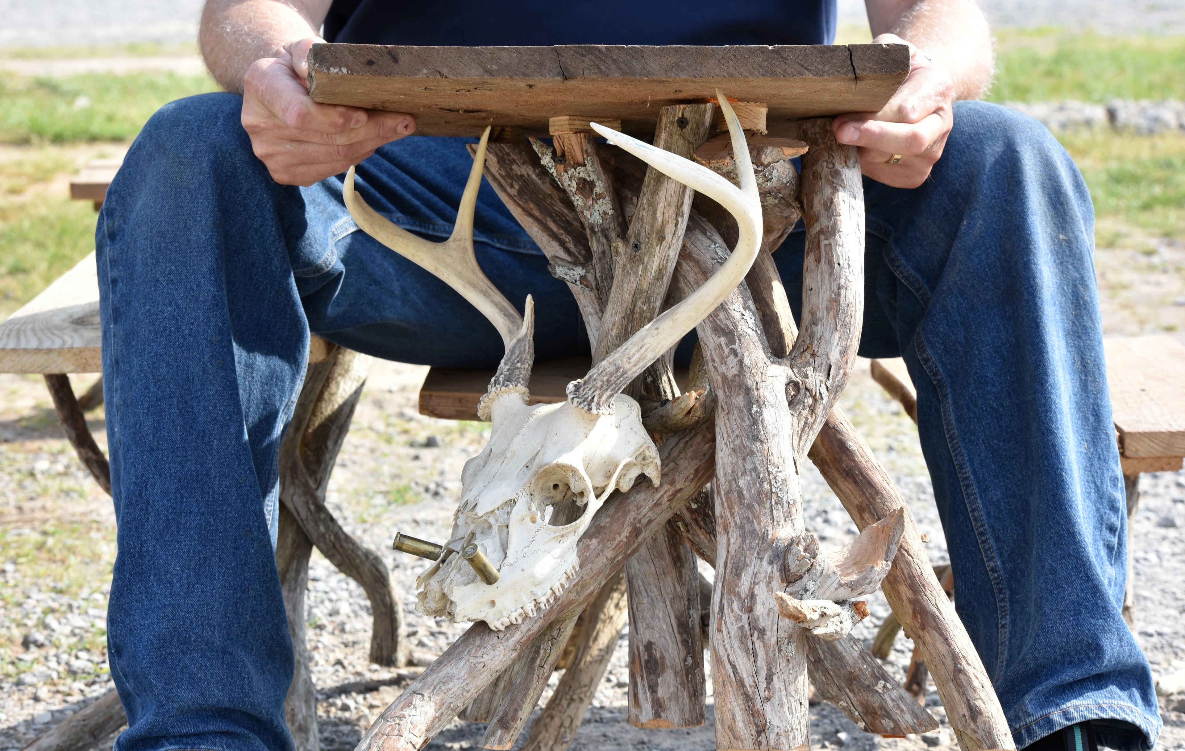 May 9, 2015 Summerville - Mike Faulkner holds a side table created by Thomas Brooks of LaFayette at Trade Days in Summerville on Saturday, May 9, 2015. In advance of Finster Fest, May 30-31 in the northwest Georgia town of Summerville. Georgia's most famed folk artist, Finster was known as a great American eccentric, and plenty of eccentric places survive him in this gritty corner of the state. HYOSUB SHIN / HSHIN@AJC.COM