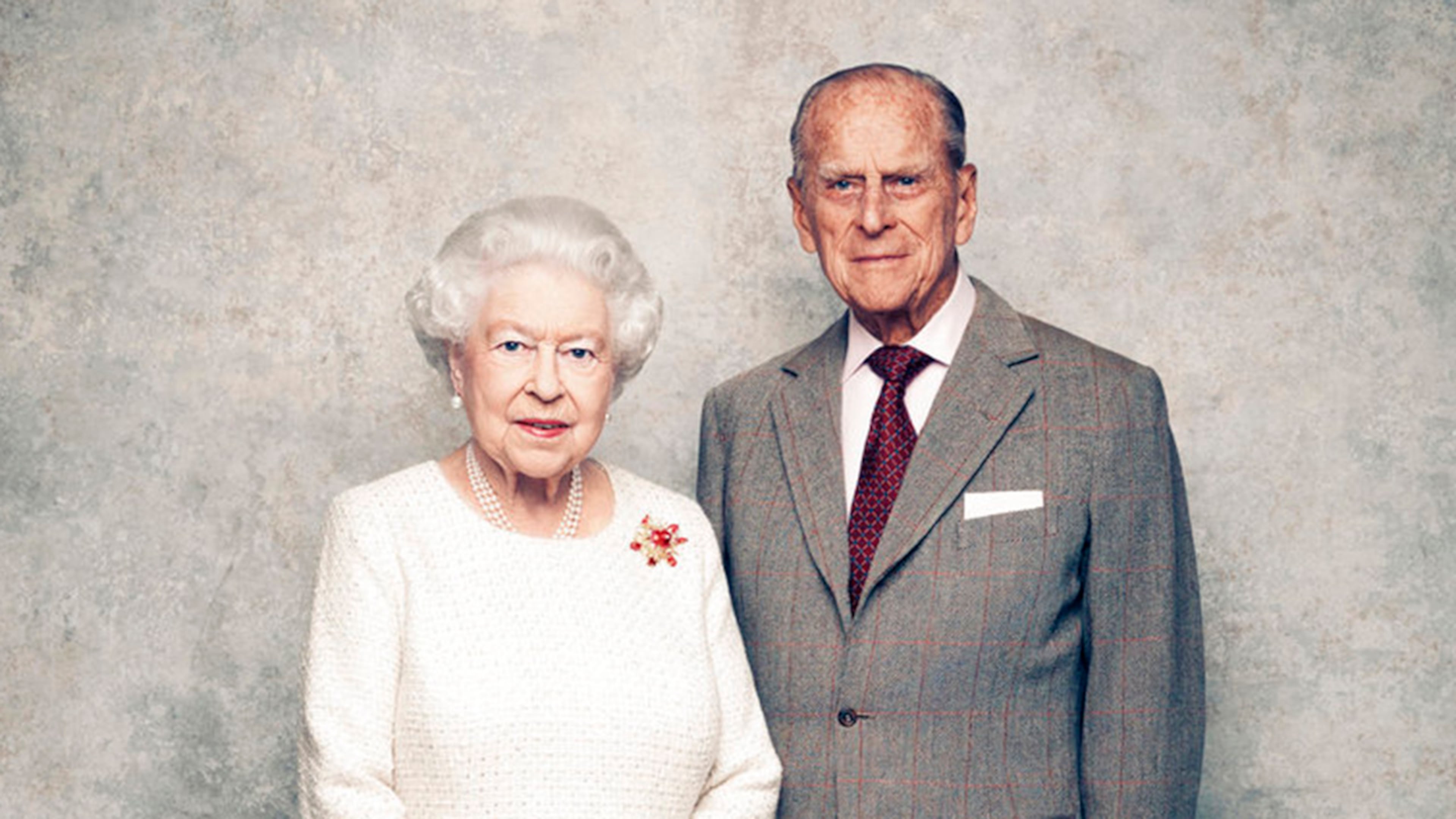 In this handout photo issued by Camera Press and taken in Nov. 2017, Britain's Queen Elizabeth and Prince Philip pose for a photograph in the White Drawing Room pictured against a platinum-textured backdrop at Windsor Castle, England. Britainâs Queen Elizabeth II and Prince Philip are marking 70 years since they wed in Londonâs Westminster Abbey. At the time, Princess Elizabeth was just 21 and Philip, a naval officer, was 26. Their wedding was a spark of joy and celebration in a country just recovering from World War II.