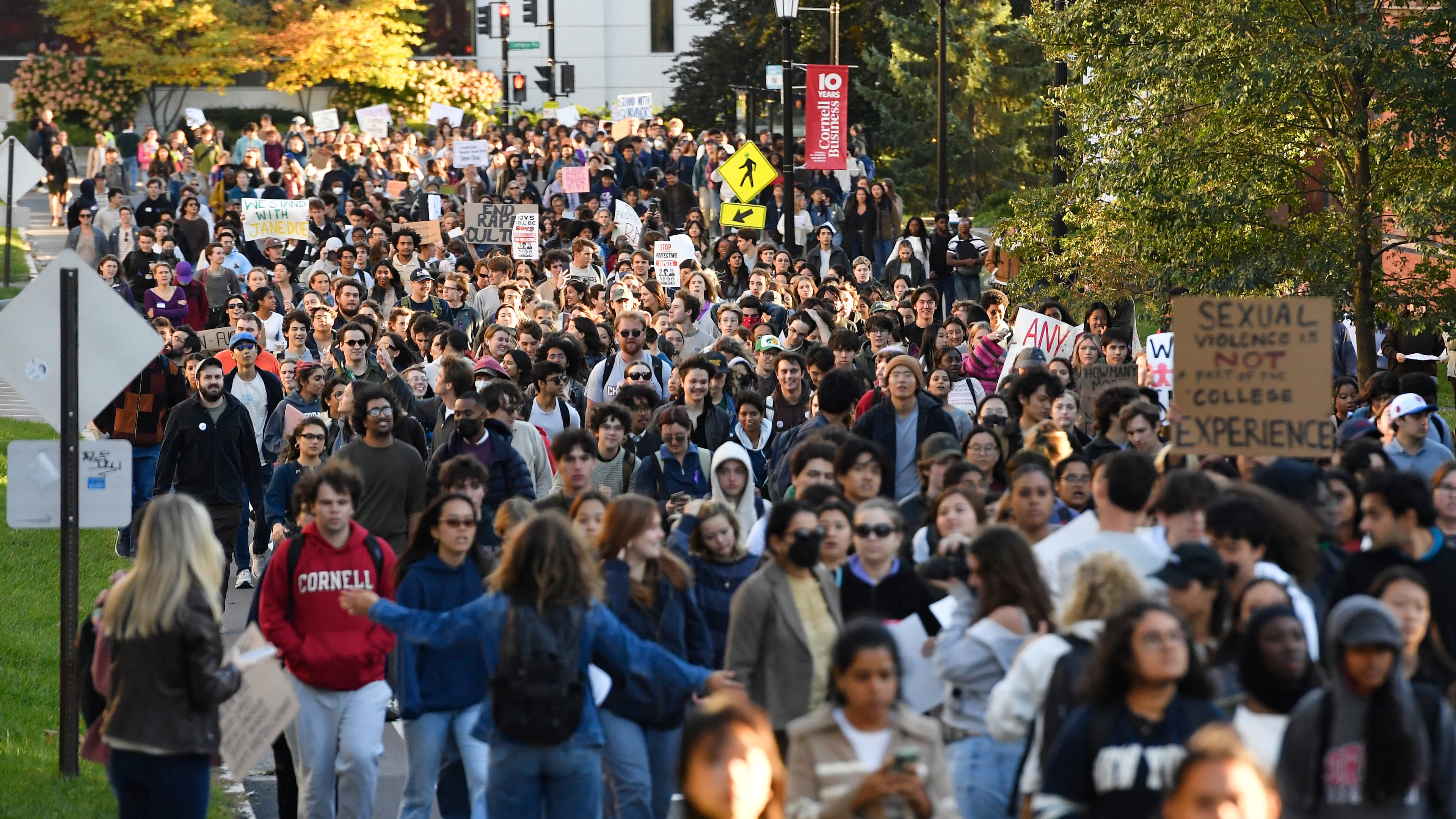 Demonstrators march during a protest Monday, Oct. 5, 2026, against Cornell University's handling of the 2024 fraternity-house gang rape allegations at the campus in Ithaca, N.Y. (Adrian Kraus/AP)