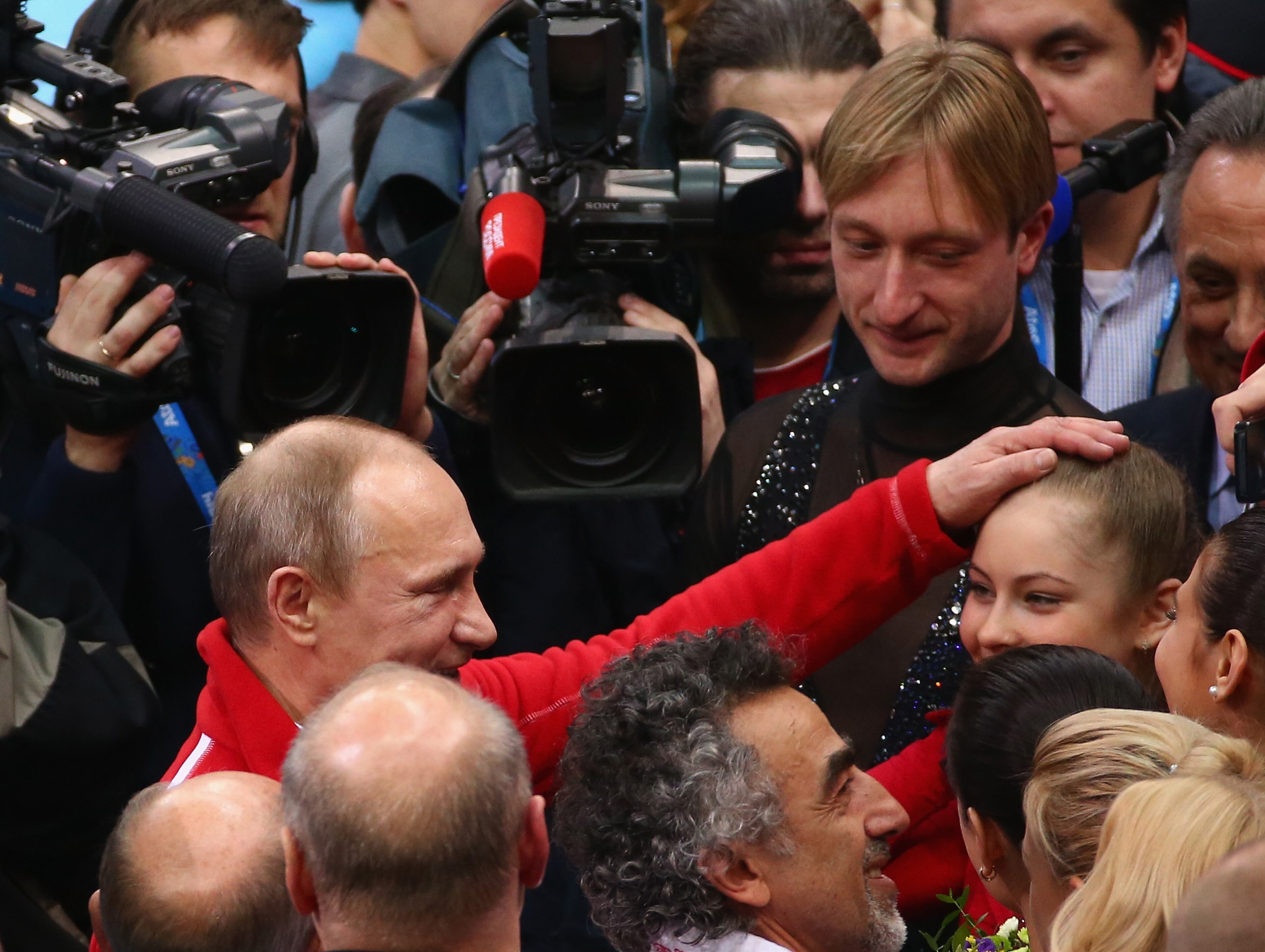 Russian President Vladimir Putin congratulates Yulia Lipnitskaya of Russia after the Team Figure Skating event on day 2 of the Sochi 2014 Winter Olympics at Iceberg Skating Palace at Iceberg Skating Palace on February 9, 2014 in Sochi, Russia. (Photo by Robert Cianflone/Getty Images)