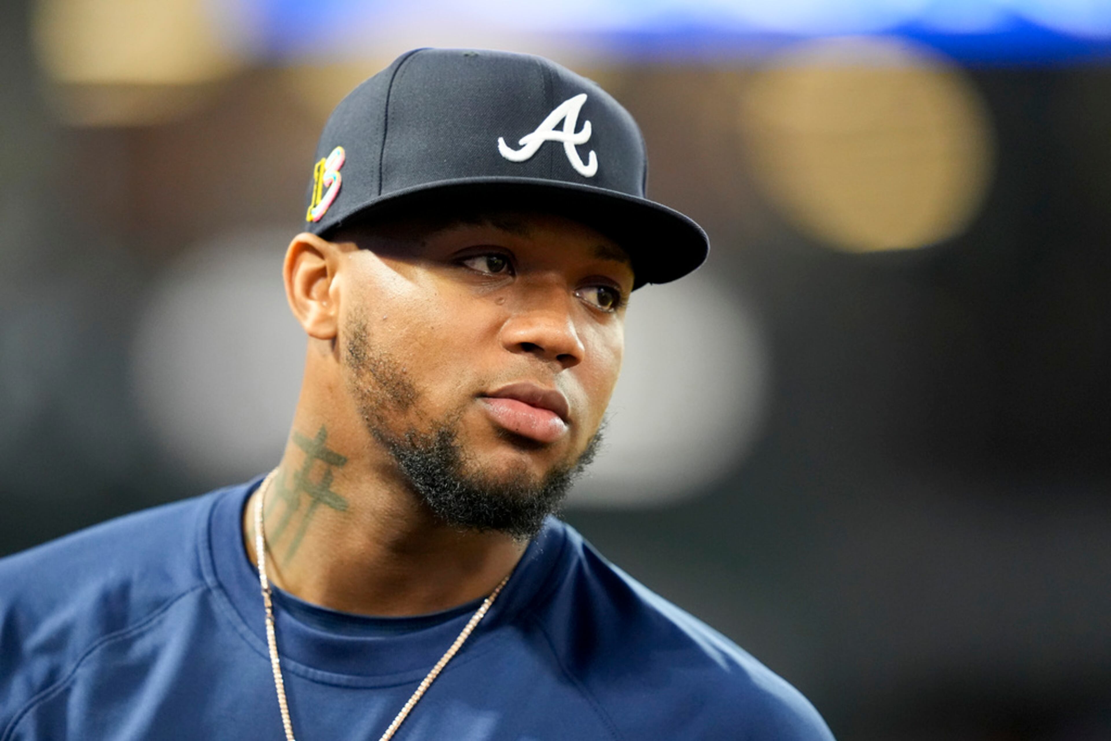 Atlanta Braves' Ronald Acuna Jr. stands in the dugout during the fifth inning of a baseball game against the Los Angeles Angels, Saturday, Aug. 17, 2024, in Anaheim, Calif. (AP Photo/Ryan Sun)