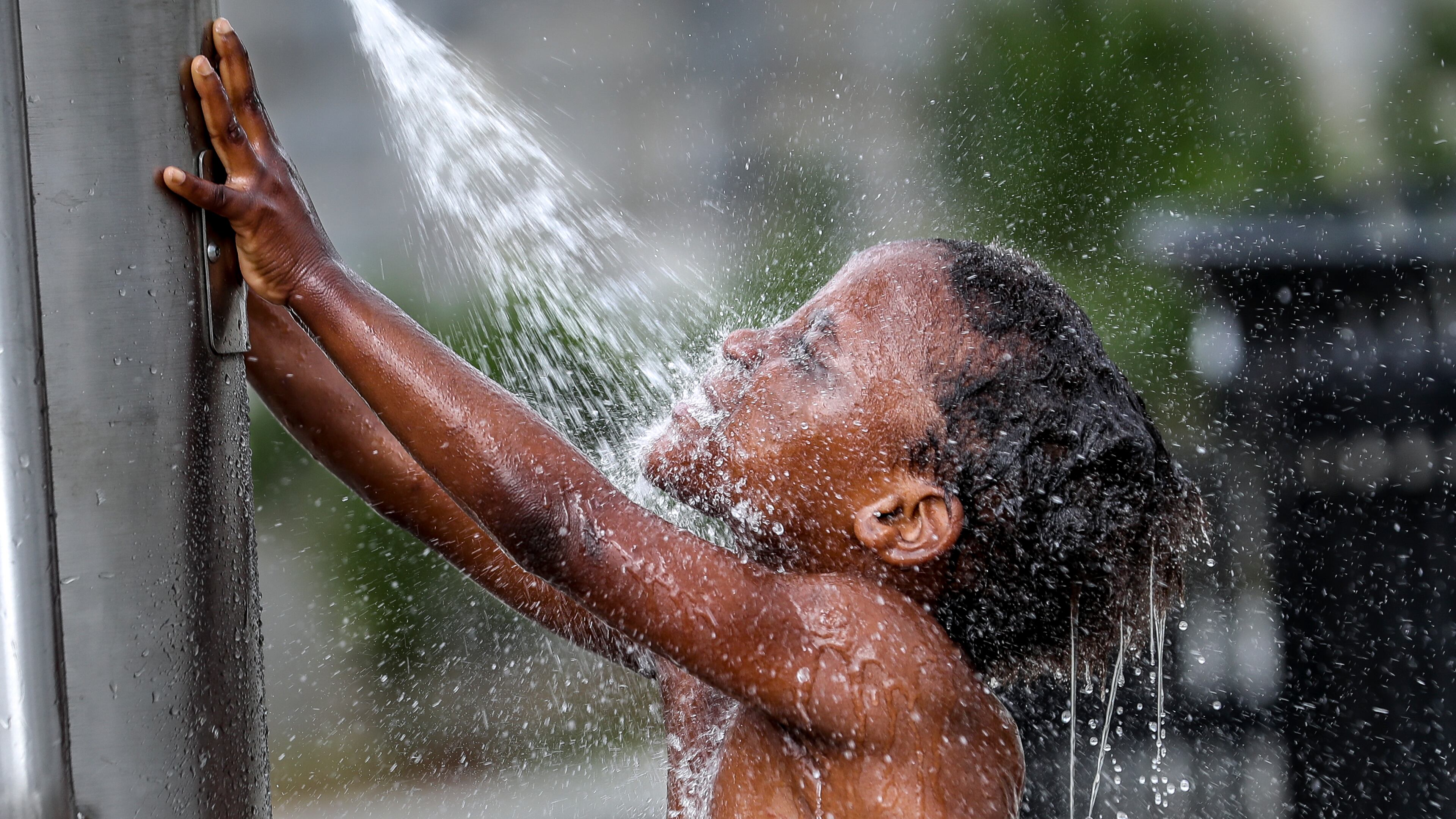 Isannah Brightwell, 5, frolicked in the water at Rodney Cook Sr. Park in Historic Vine City located at Vine Street and Joseph E. Boone Boulevard in Northwest Atlanta on Thursday, June 15, 2023. Isannah’s mother, Rahkisha Brightwell, brought her and all 7 of her children to the park on Thursday.